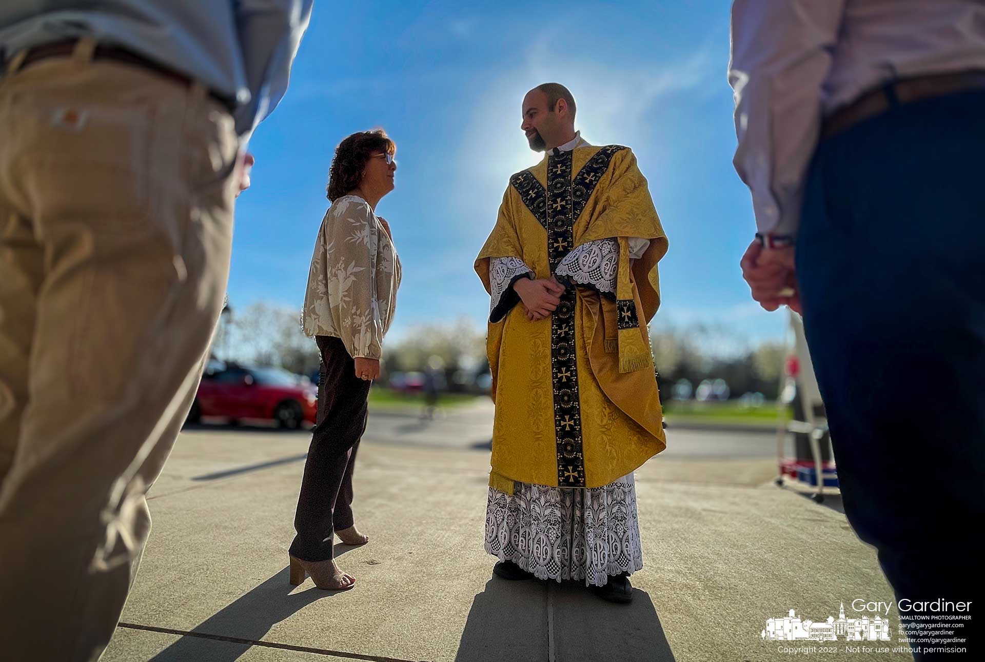 Father PJ Brandimarti talks with a parishioner after early Sunday Mass where he announced he is being transferred to a different parish in July. My Final Photo for April 24, 2022.