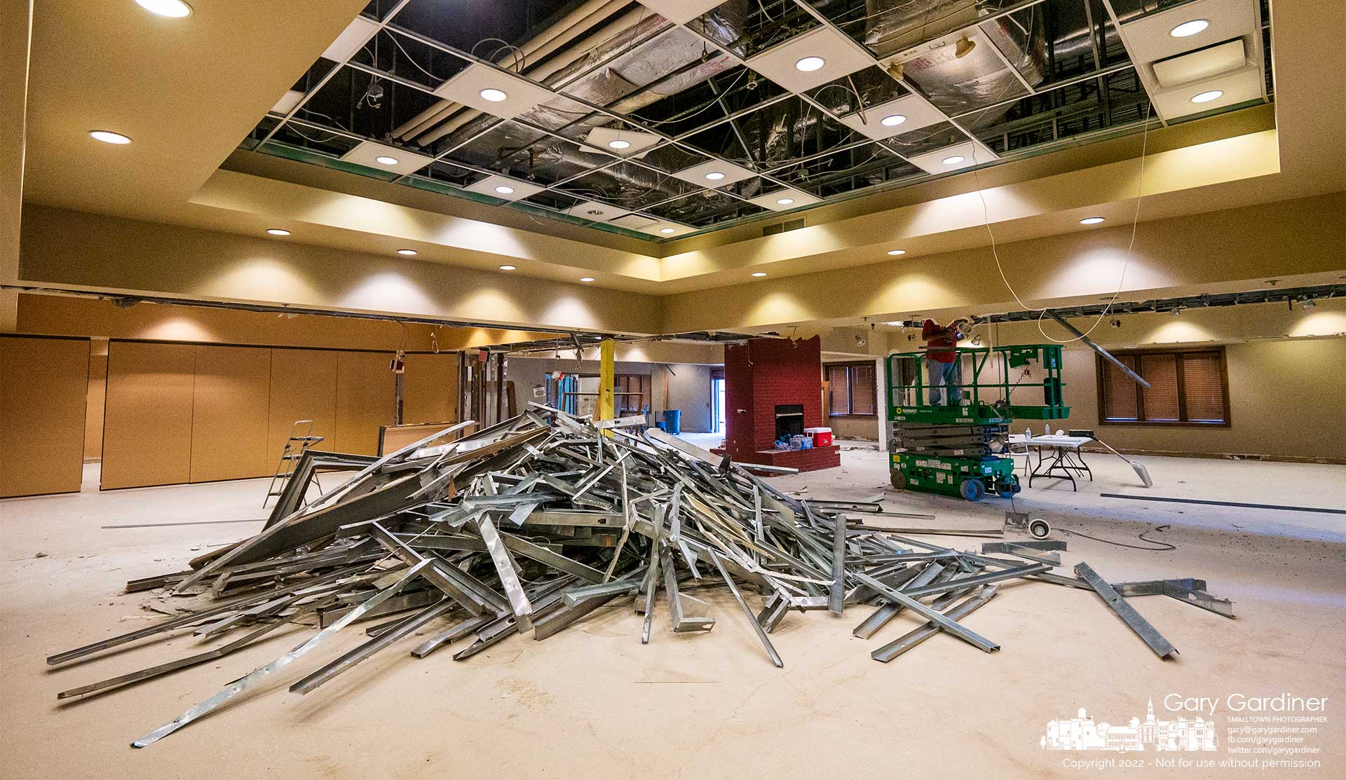 A collection of galvanized steel framing and other metal material lies in a pile where a contractor is demolishing the interior of the closed MCL cafeteria converting it into five separate business fronts, one of which will be a coffee shop. My Final Photo for June 2, 2022.