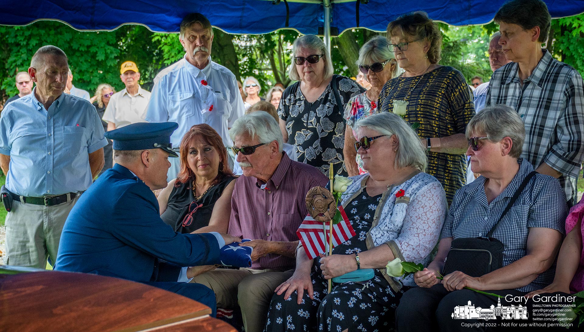 David Lilley, surrounded by family and friends, accepts the flag that covered his brother's casket after a military funeral honoring the Korean War soldier whose remains were recently identified after 71 years. My Final Photo for June 14, 2022.