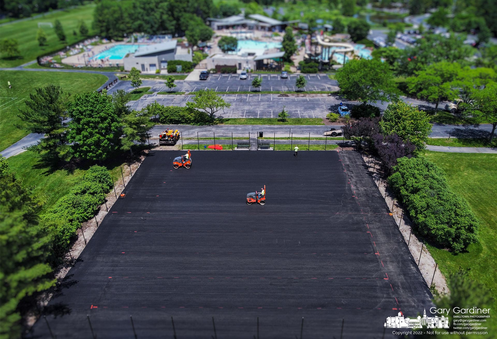 A pair of steamrollers compress the first layer of asphalt at the highlands tennis courts where the city updates the surface. My Final Photo for June 3, 2022.
