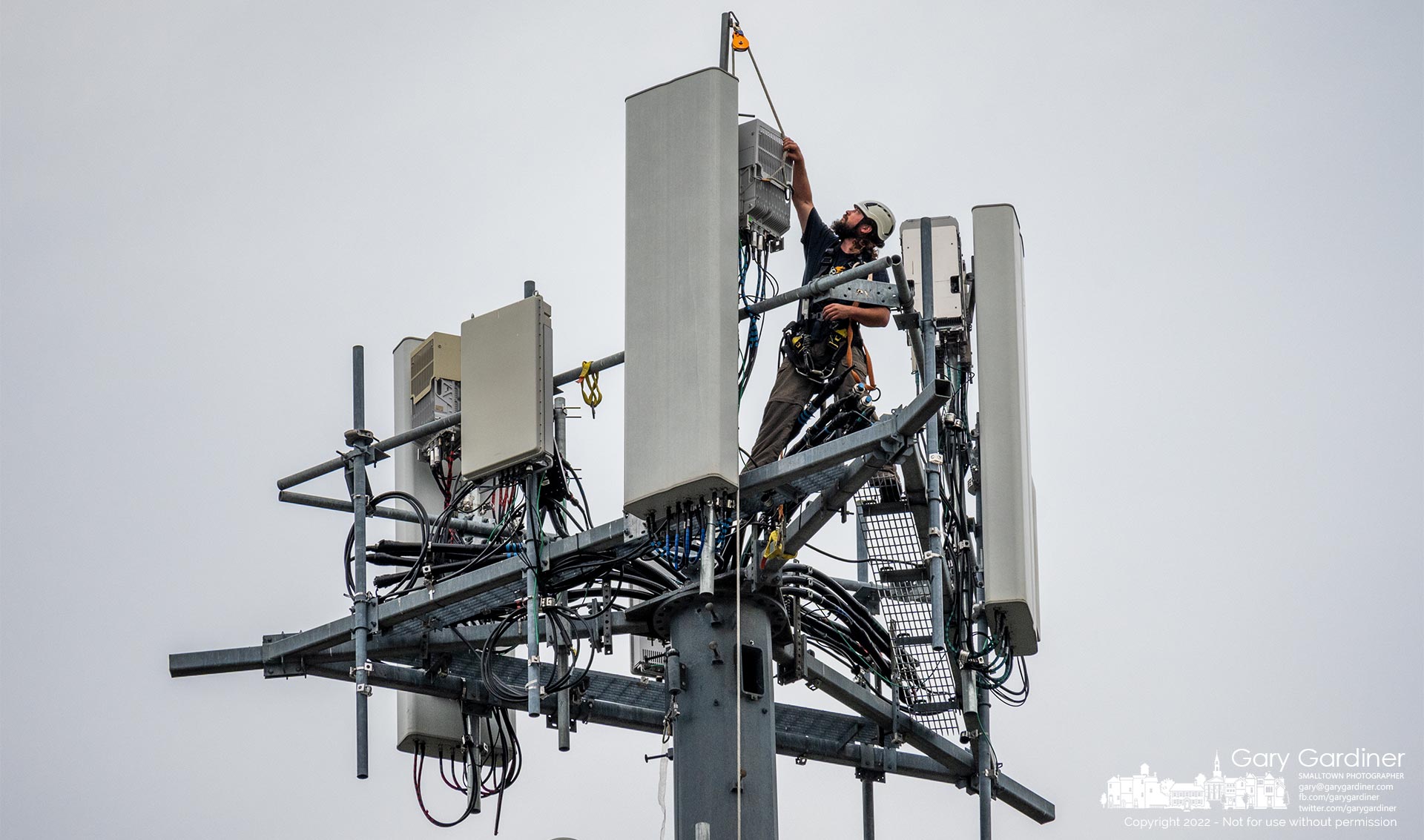 A technician replaces a T-Mobile cellular radio at the top of the tower along Alum Creek near the West Main Street bridge. My Final Photo for July 26, 2022.
