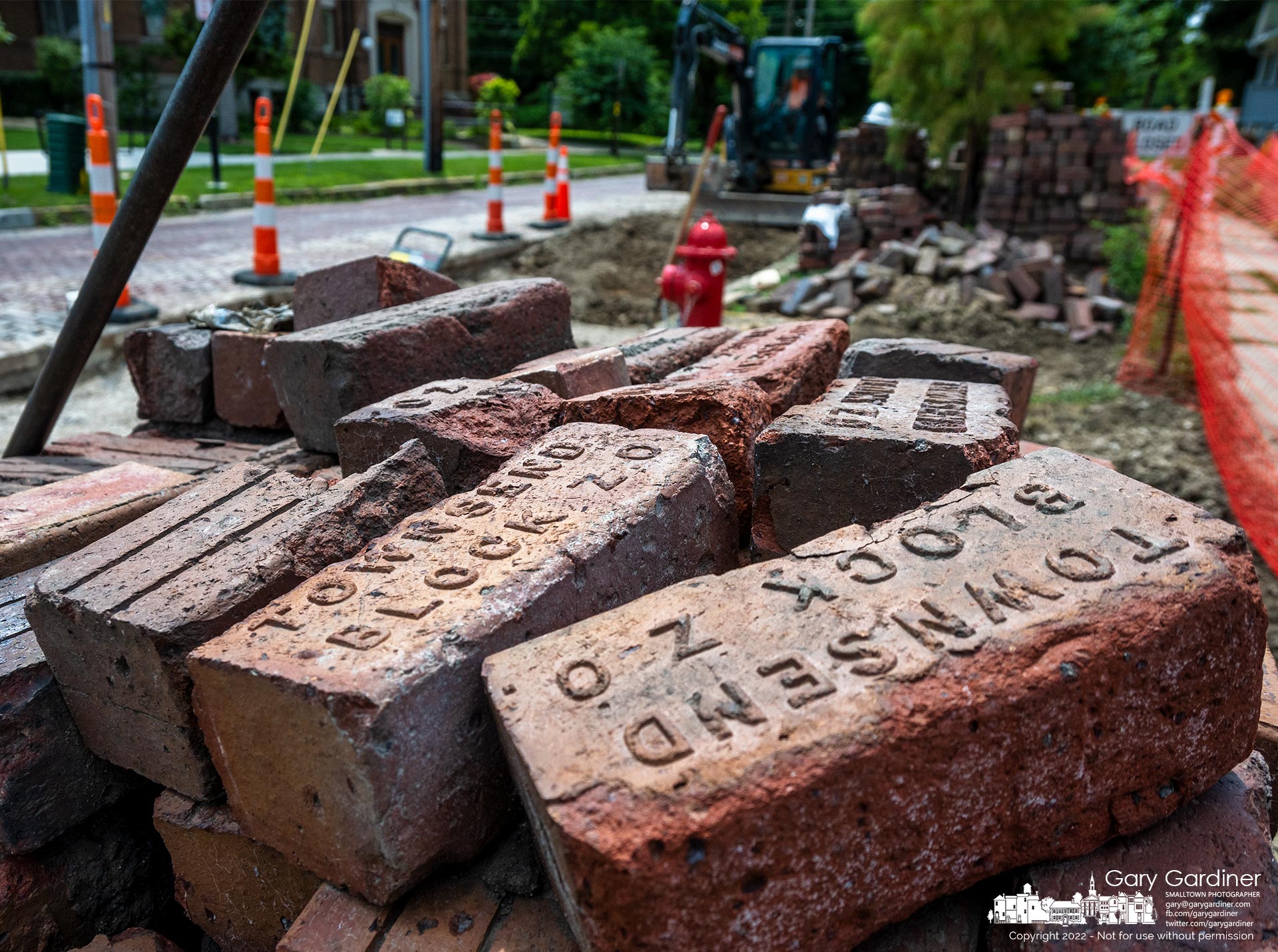 Brick pavers pulled from West College Street sit in piles waiting to be returned to the street following upgrades to the city water main. My Final Photo for July 21, 2022.