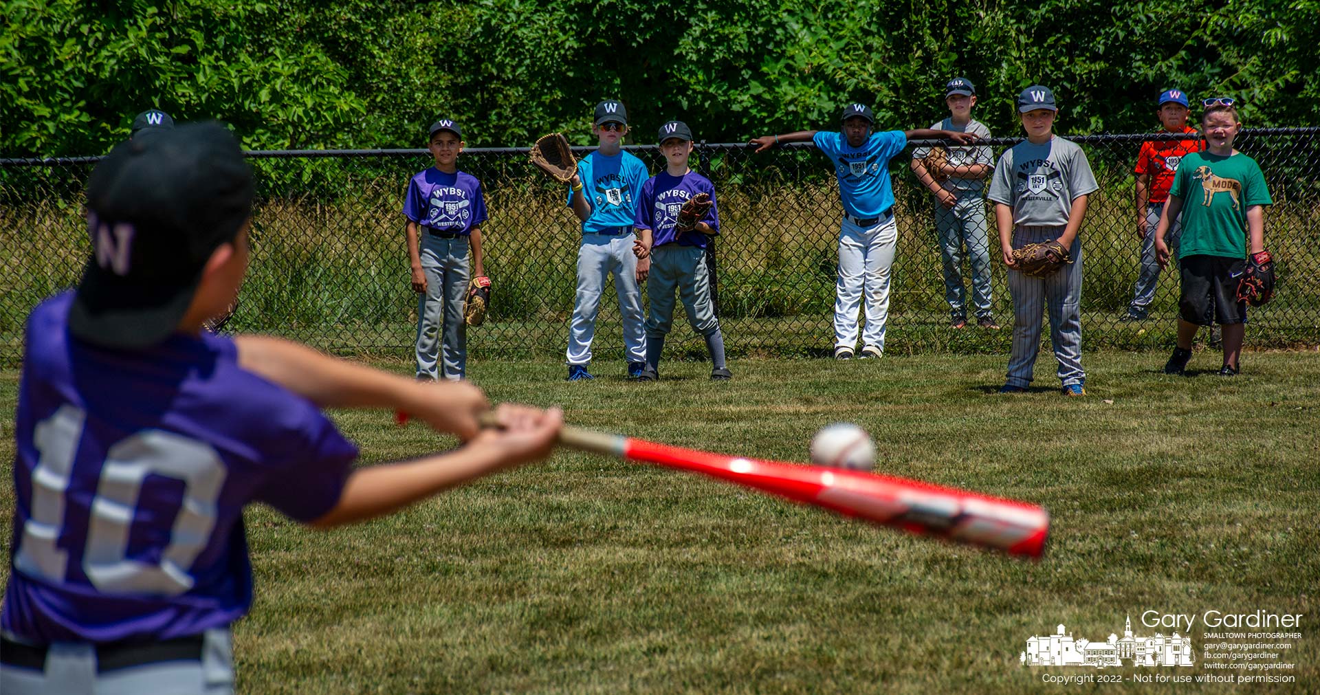 Westerville Youth Baseball and Softball League All-Star outfielders line up at the home run fence as one of their teammates swings during the home run competition at Huber Village Park Saturday afternoon. My Final Photo for July 2, 2022.