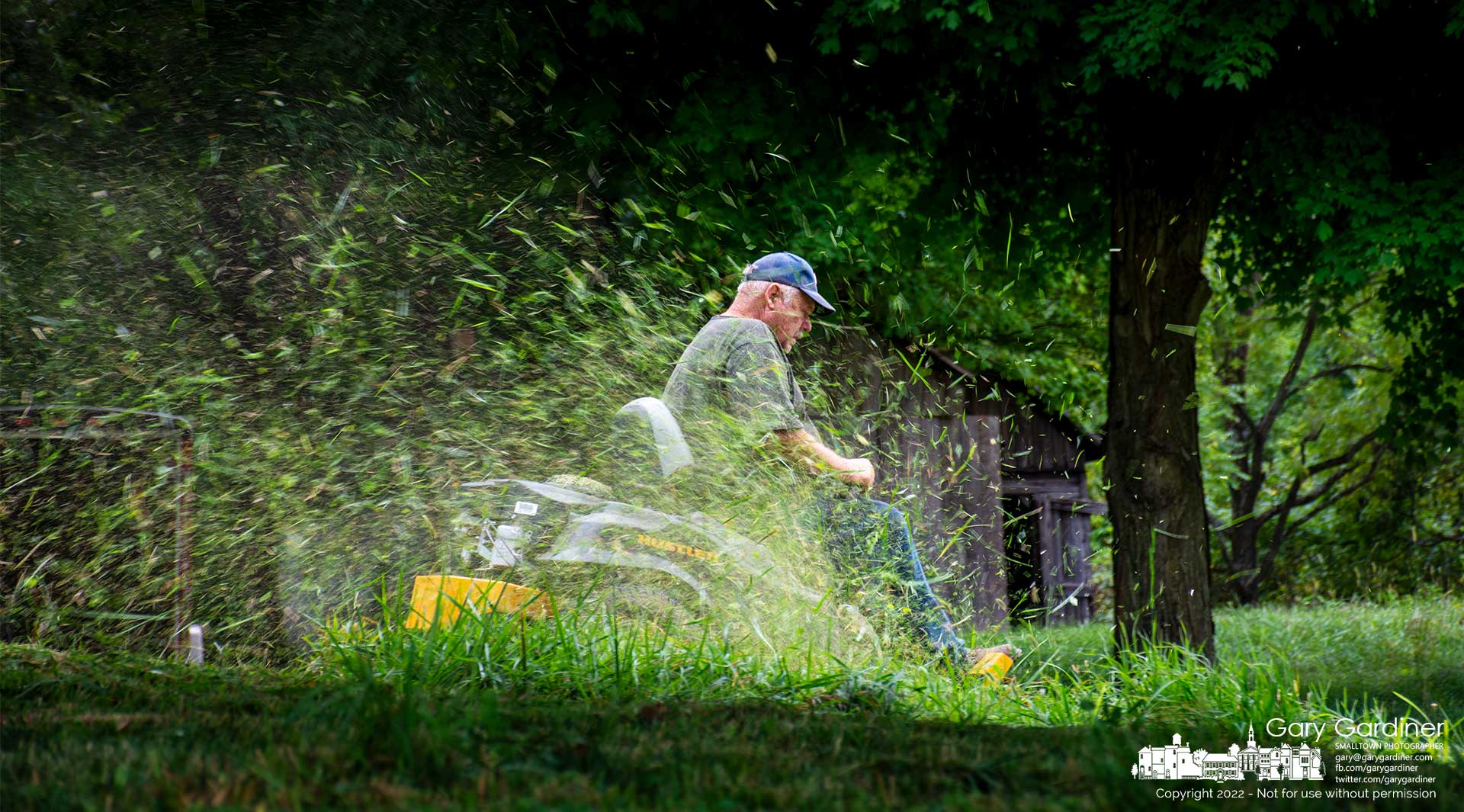 Kevin Scott mows grass around the Sharp family home on Africa road hoping to get it done before the threat of an afternoon rain storm. The rain never came but Scott had to stop when the drive belt for the mower's blade shredded. My Final Photo for August 29, 2022.