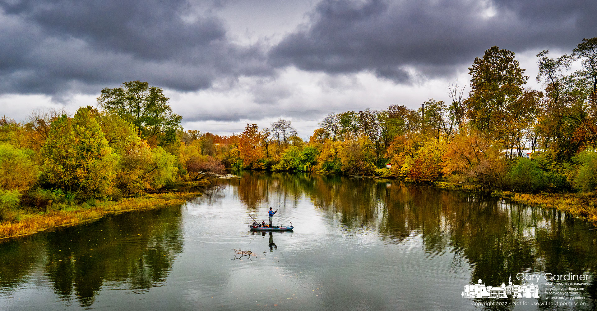 A fisherman casts into the shallows of Alum Creek just below the Main Street bridge in Westerville with hopes the weather and the fish will cooperate in his endeavors. My Final Photo for October 19, 2022.