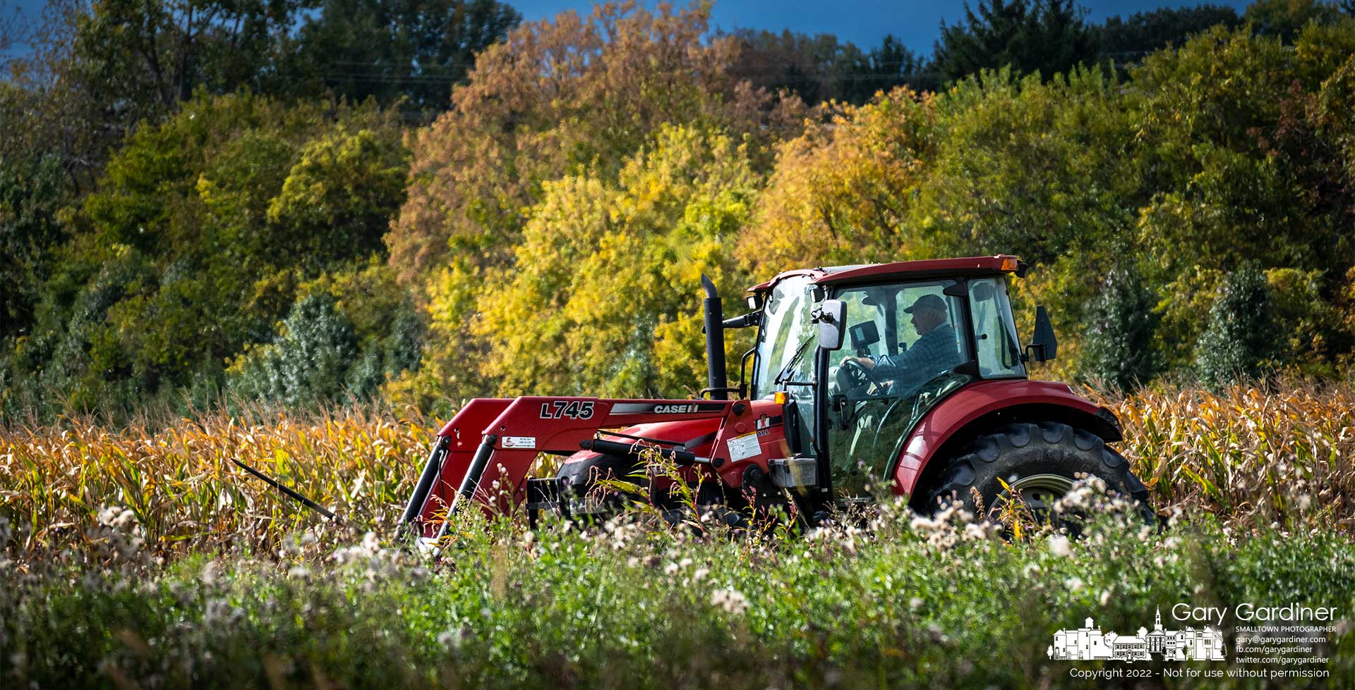Farmer Kevins Scott mows weeds and overgrown grass in one of the fields at the Braun Farm clearing it for parking for a future Otterbein event. My Final Photo for Oct. 7, 2022.