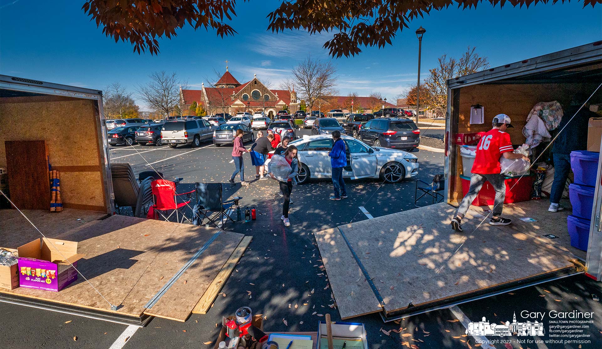 A volunteer crew collects donated household goods in the parking lot at St. Paul the Apostle Catholic Church and loads them into trailers to be later sported and cataloged for the St. Vincent DePaul Society's assistance programs. My Final Photo for October 23, 2022.