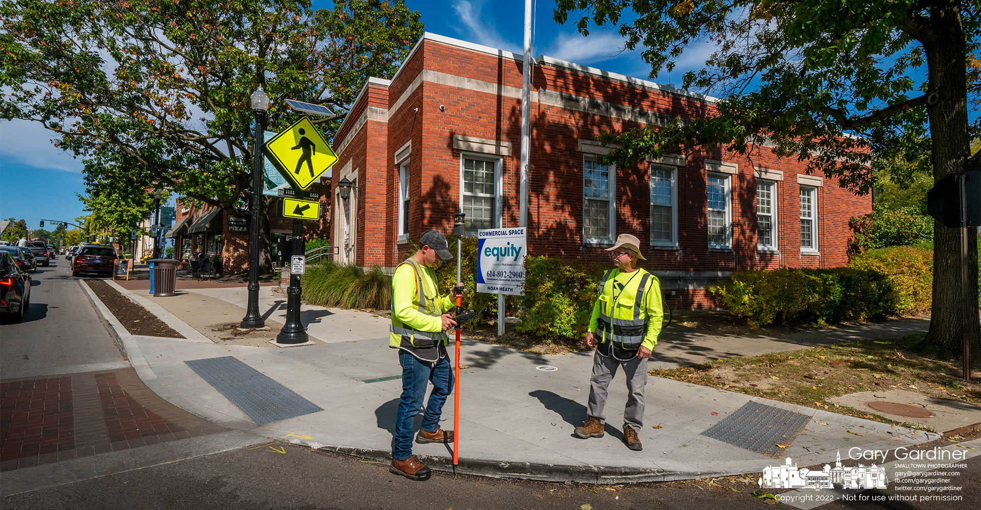 A survey crew marks locations in the Uptown Westerville block that contains the former police detective bureau in the old Post Office, Java Central, Westerville Florist, and other buildings within the alleys behind those buildings. My Final Photo for October 4, 2022.