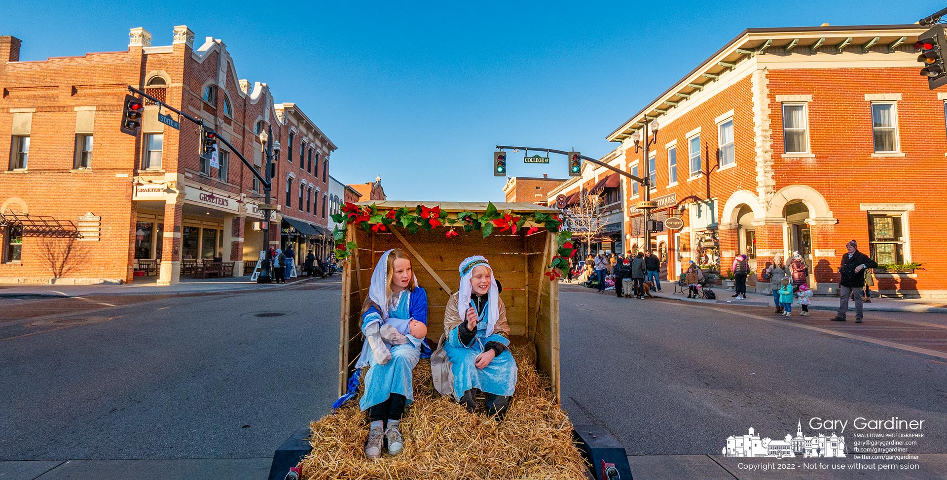 Mary, Joseph, and their baby, Jesus, ride backward in a hay-covered trailer float where they followed high school bands, dance groups, and martial arts students in the annual Christmas parade through Uptown Westerville. My Final Photo for December 4, 2022.
