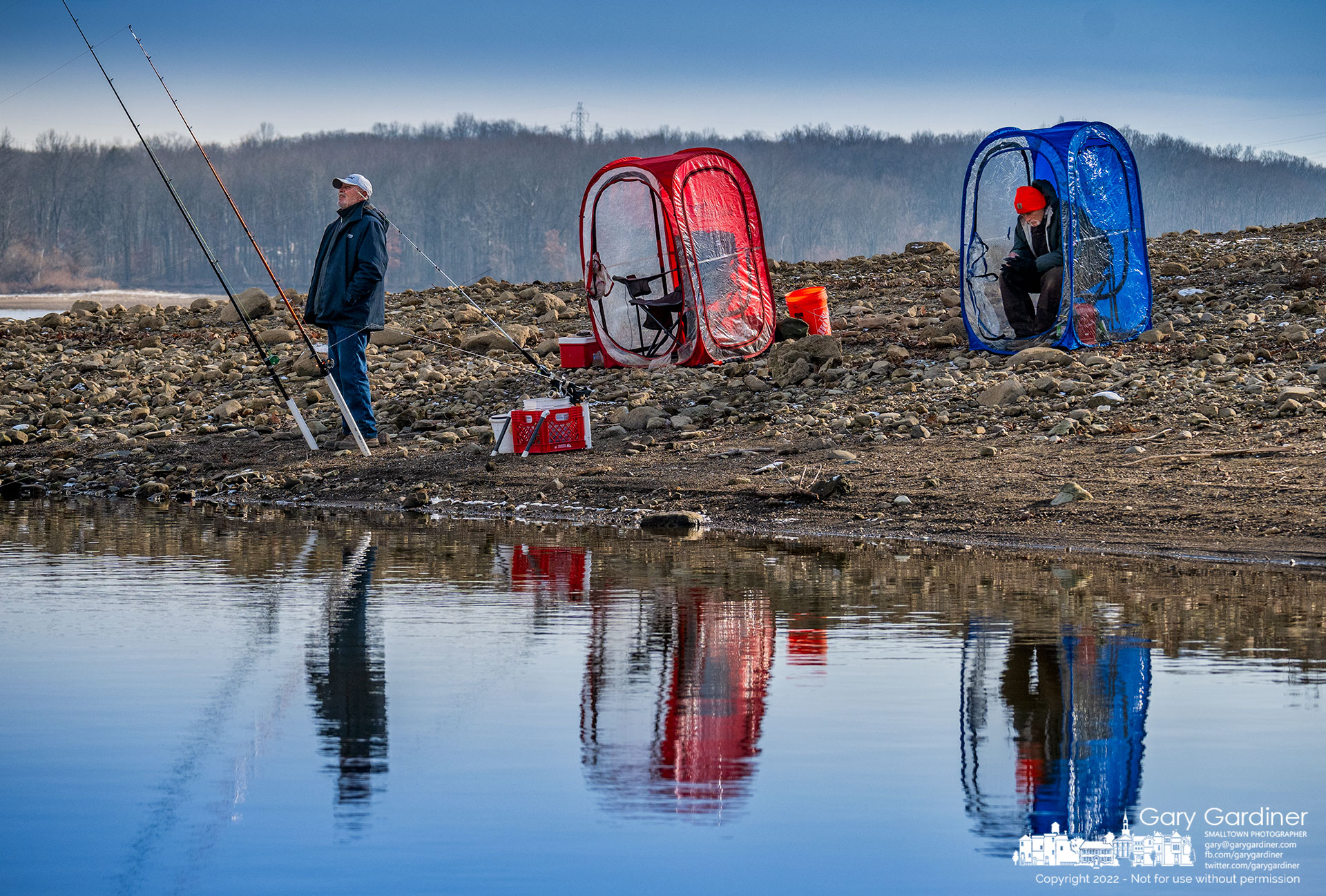 A pair of fishermen take advantage of clear skies and a light breeze to cast their lures into the waters of Hoover Reservoir hoping for a bit of luck before the weather becomes too cold even for their portable fishing shelters. My Final Photo for December 20, 2022.