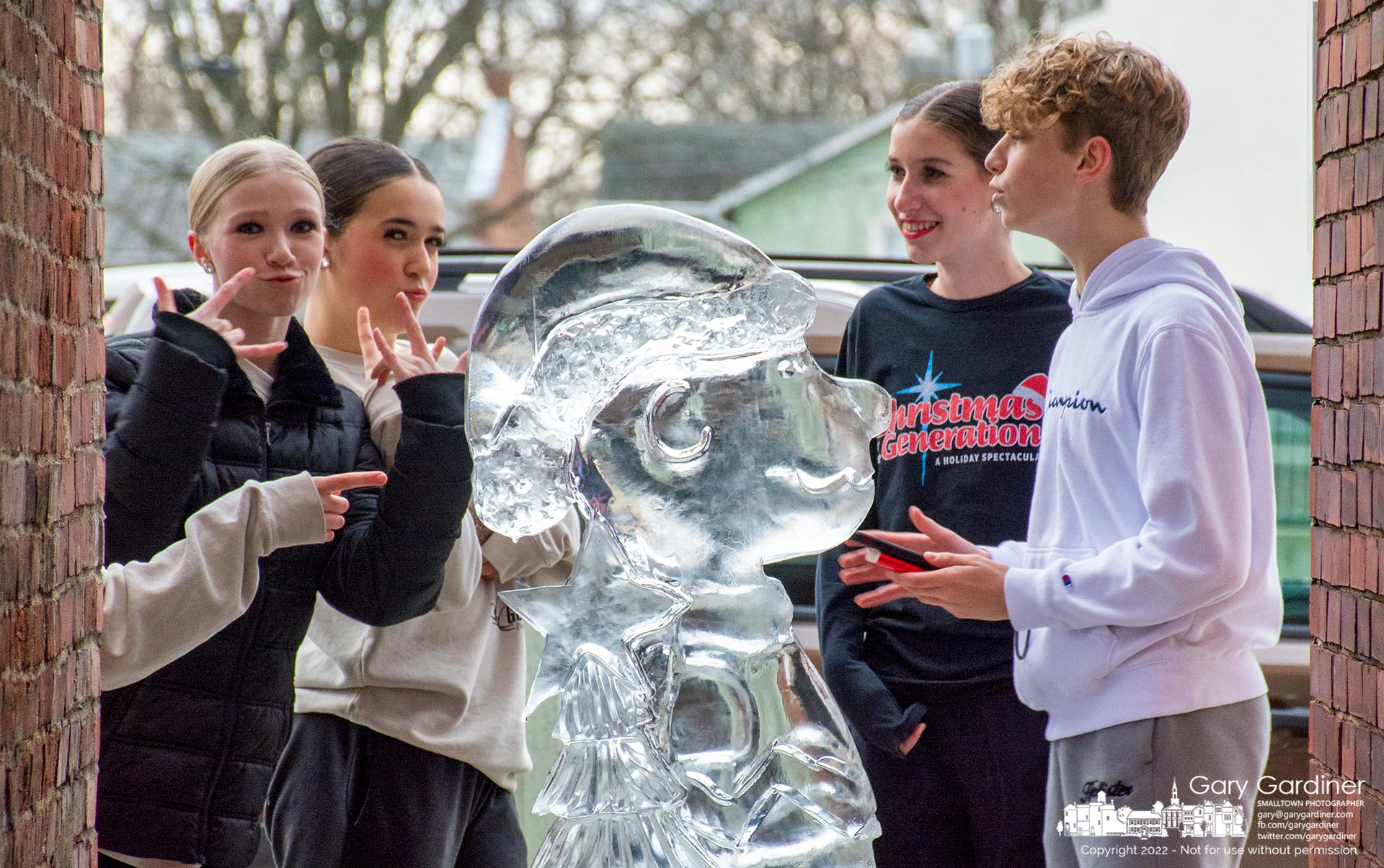 Dancers strike poses around Charlie Brown, one of 36 ice sculptures set on sidewalks in Uptown Westerville for the Christmas season. My Final Photo for December 16, 2022.