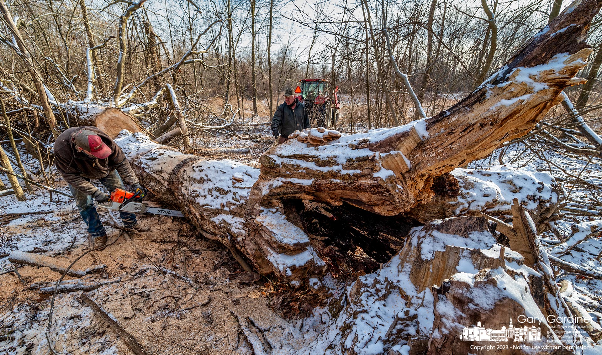 Rodney and Kevin cut a fallen tree into sections small enough to be split into firewood from a field on Africa Road that they help manage in Westerville. My Final Photo for January 31, 2023.