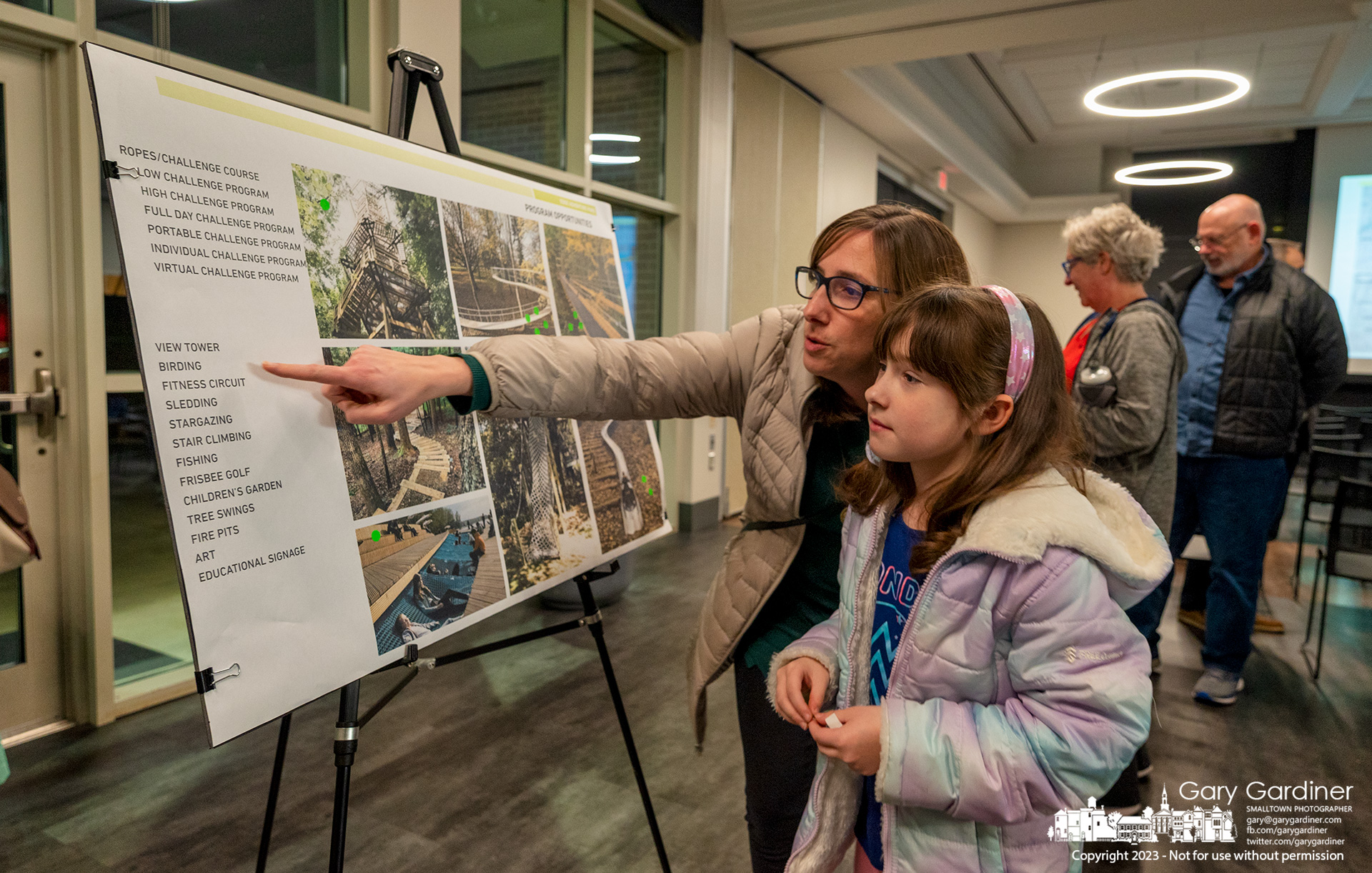 A mother and daughter select ideas for Westerville's Edge Adventure Park during the first public planning meeting about building the new park in a deep ravine along Alum Creek. My Final Photo for January 12, 2023.