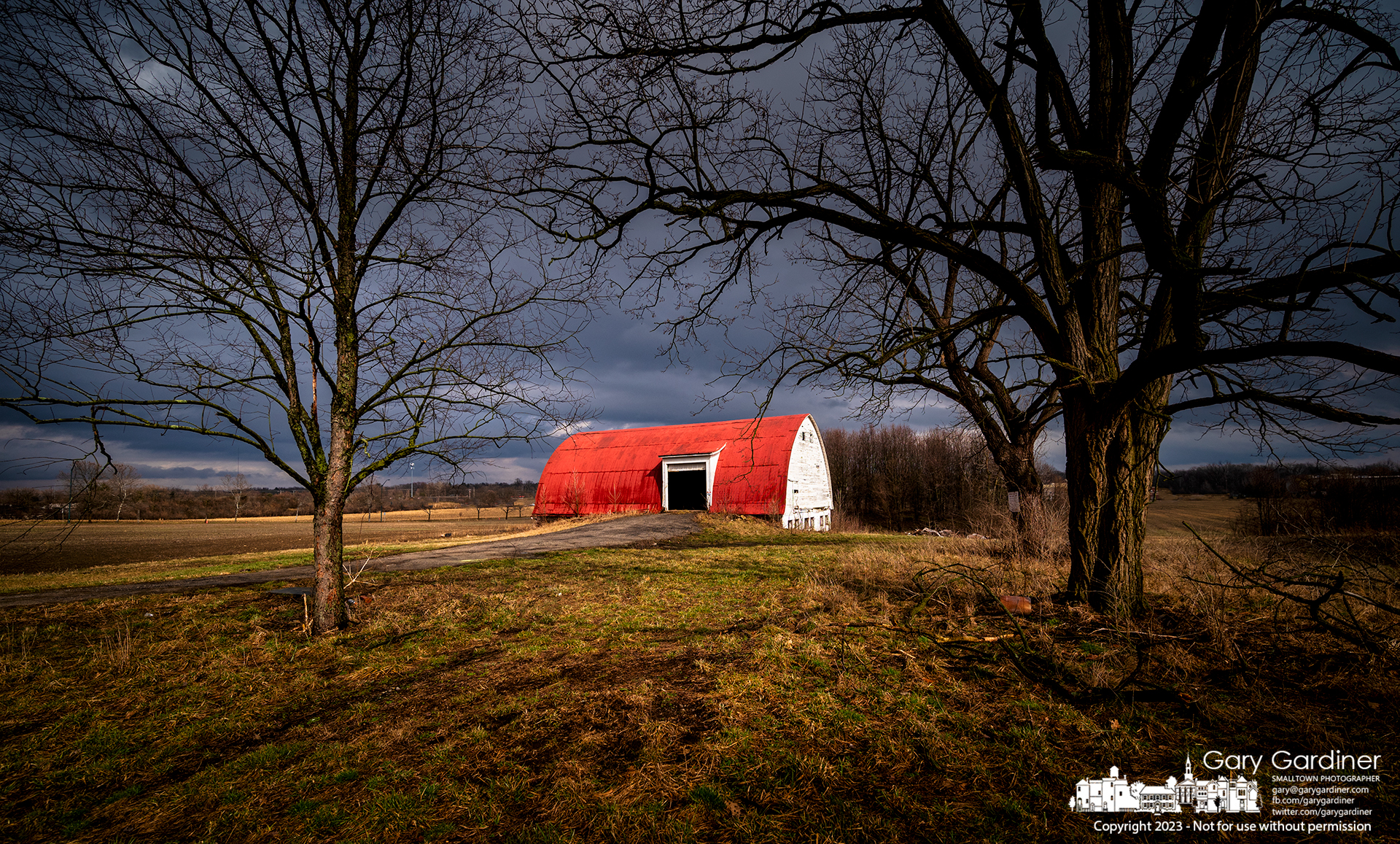 The afternoon sun breaks through thick storm clouds illuminating the old barn on the Braun Farm. My Final Photo for February 27, 2023.
