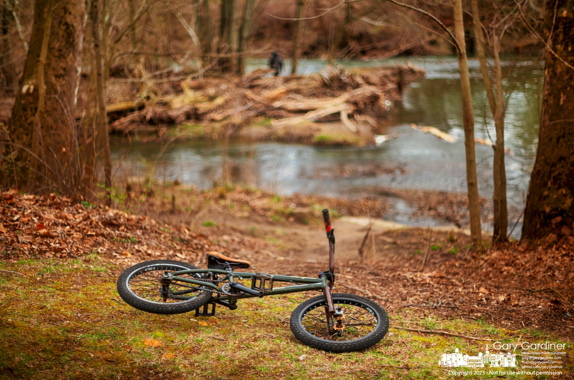 A young fisherman's bicycle lies in the grass near the Alum Creek dam where he and a friend dropped their bikes, donned wading boots, and traveled into the waters of the dam for an afternoon of testing their skill and luck in the high waters of the creek. My Final Photo for March 27, 2023.