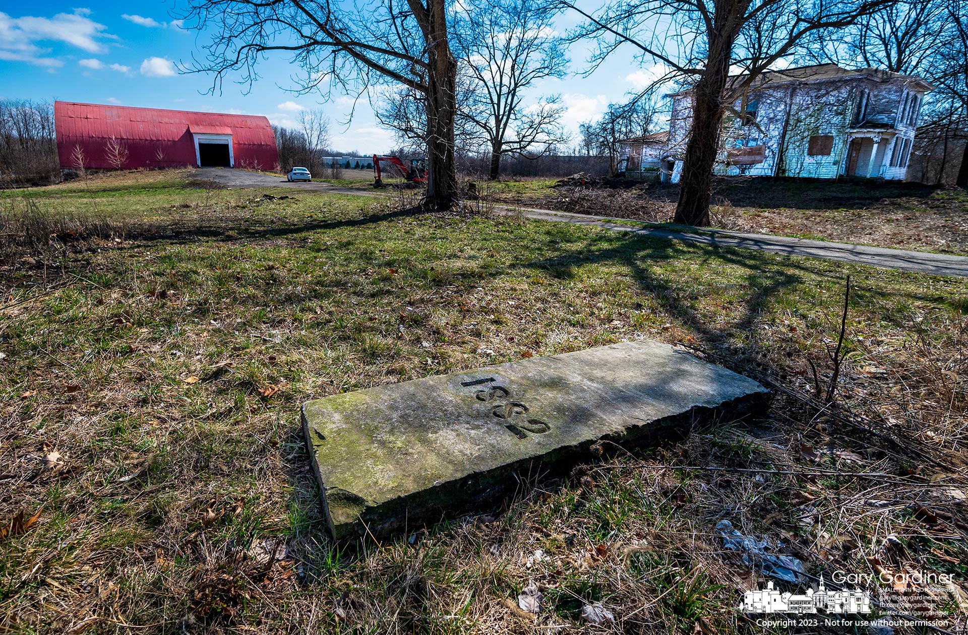 The 1882 marker at the Braun Farm sits in a temporary location removed from where it was in danger of damage by trucks and equipment used to demolish the house and barn. My Final Photo for March 4, 2023.