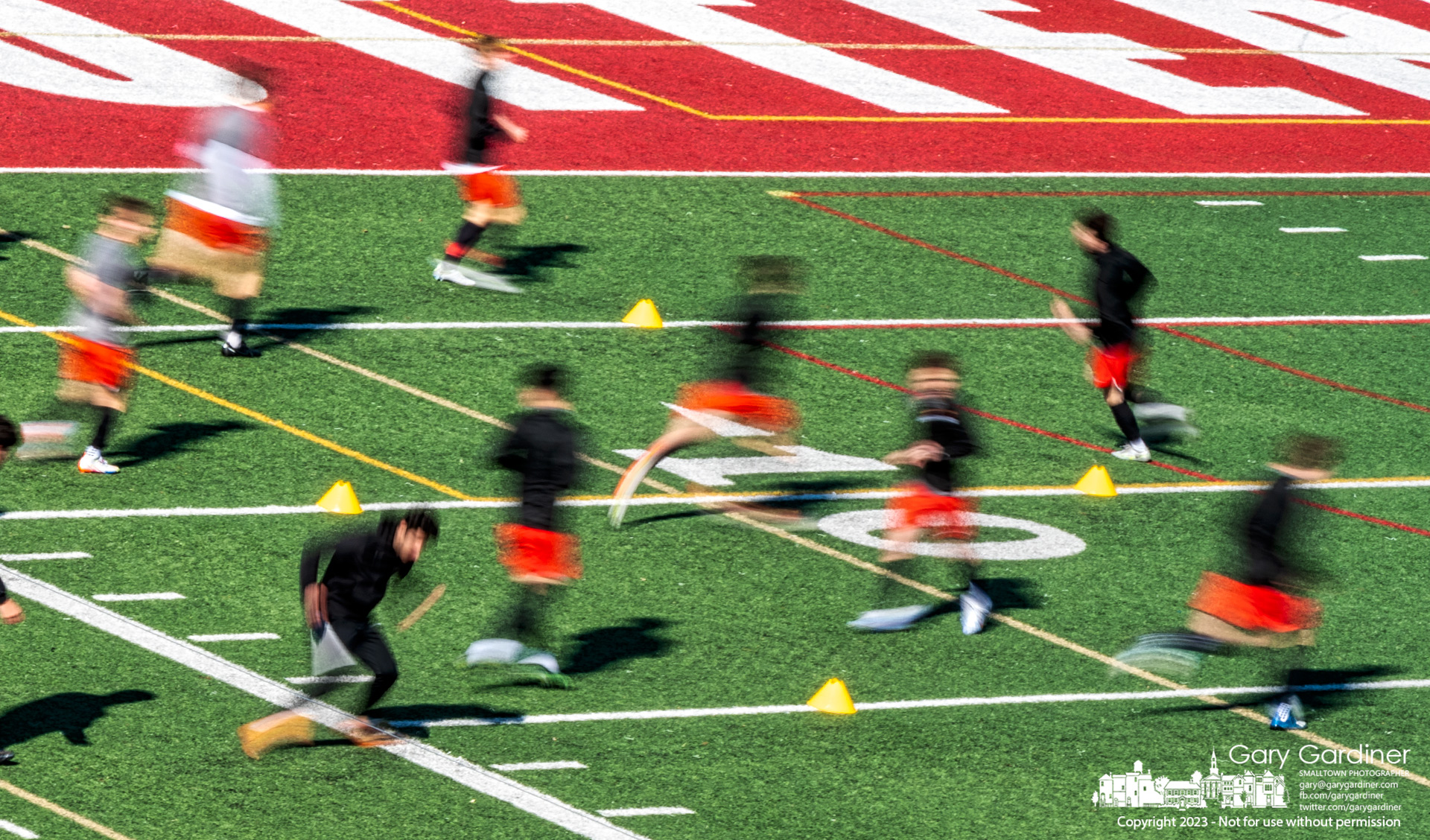 The Otterbein soccer team is a blur as they run through drills at the start of practice with temperatures near freezing. My Final Photo for March 19, 2023.