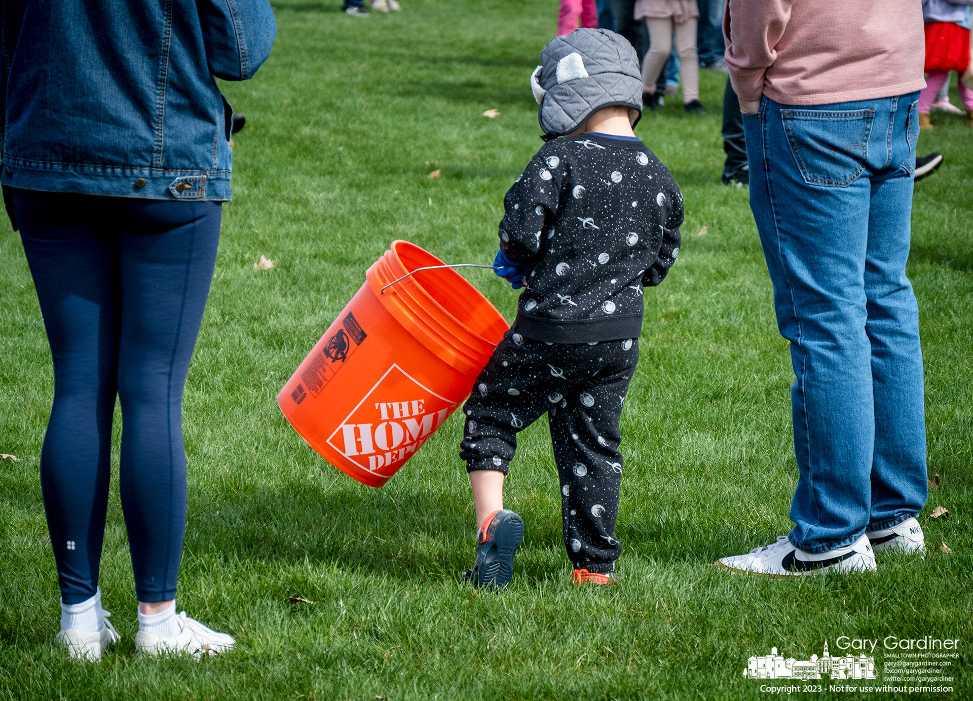 A young Easter egg hunter showed up with a five-gallon bucket to hold his collection of eggs at the city's Spring Eggstravaganza at Hoff Woods Park. My Final Photo for April 8, 2023.