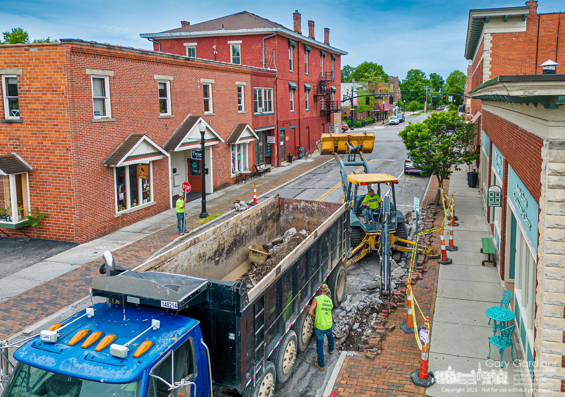 A concrete contractor removes broken, cracked, and eroded gutters from East College near Uptown as the first stage of resurfacing College from State to Spring. My Final Photo for May 16, 2023.