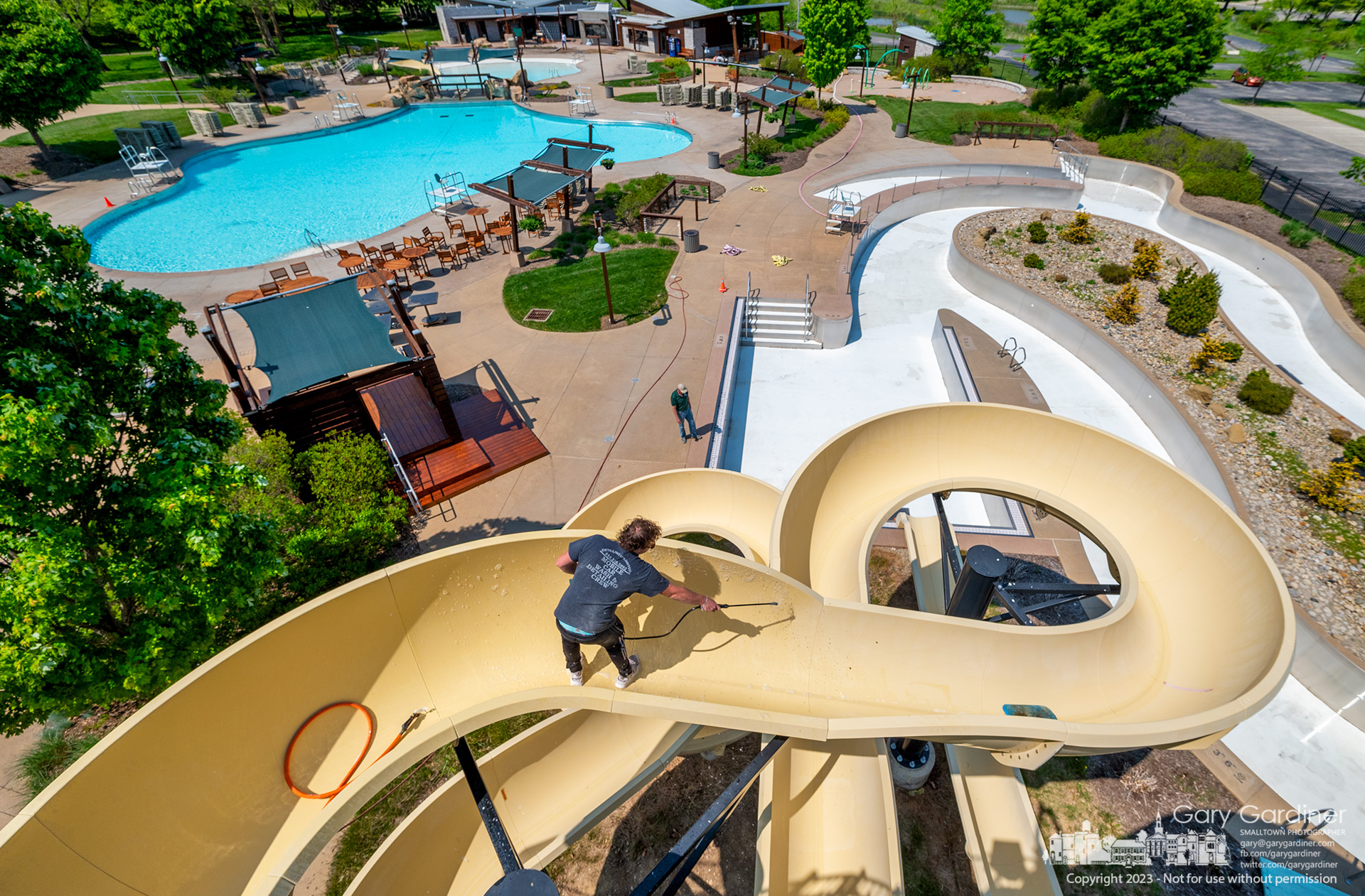 The slide at Highlands gets a washing, scrubbing, waxing, and buffing before the pool opens next weekend for the 2023 season. My Final Photo for May 17, 2023.
