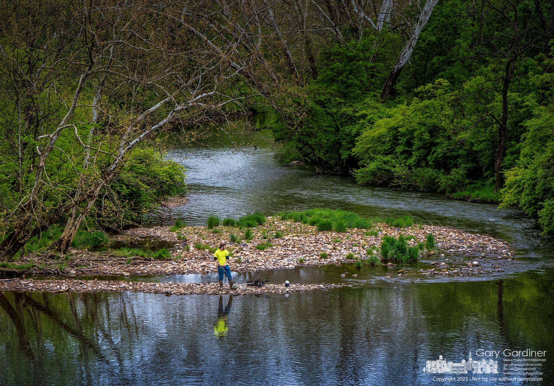 A fisherman tosses his lure into the waters of Big Walnut Creek as it moves past a pile of exposed till about a half mile below Hoover Dam. My Final Photo for May 7, 2023.
