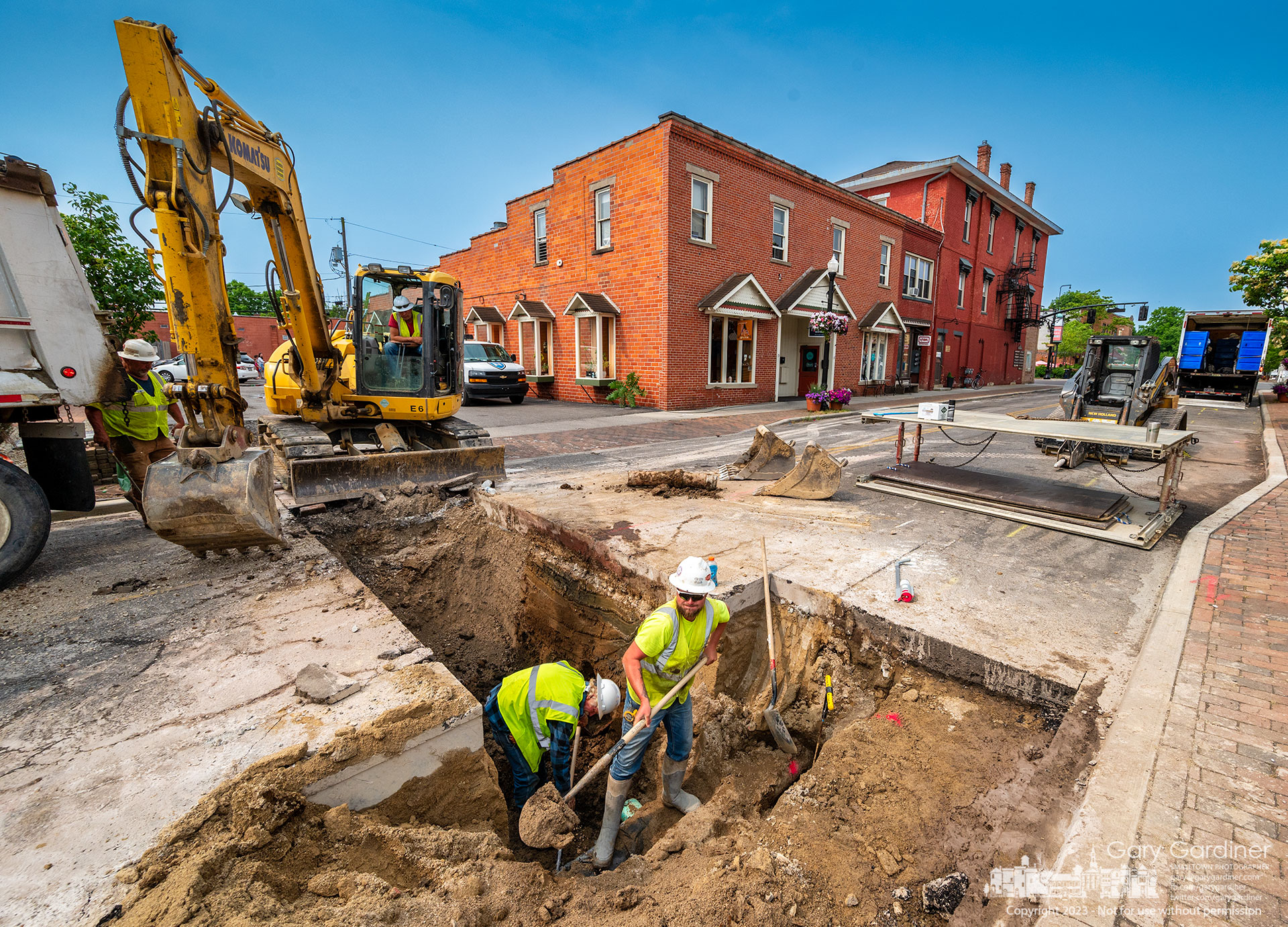 Workers clear a trench on East College Avenue where a new water pipeline will be laid before the street is repaved this month. My final Photo for June 5, 2023. 
