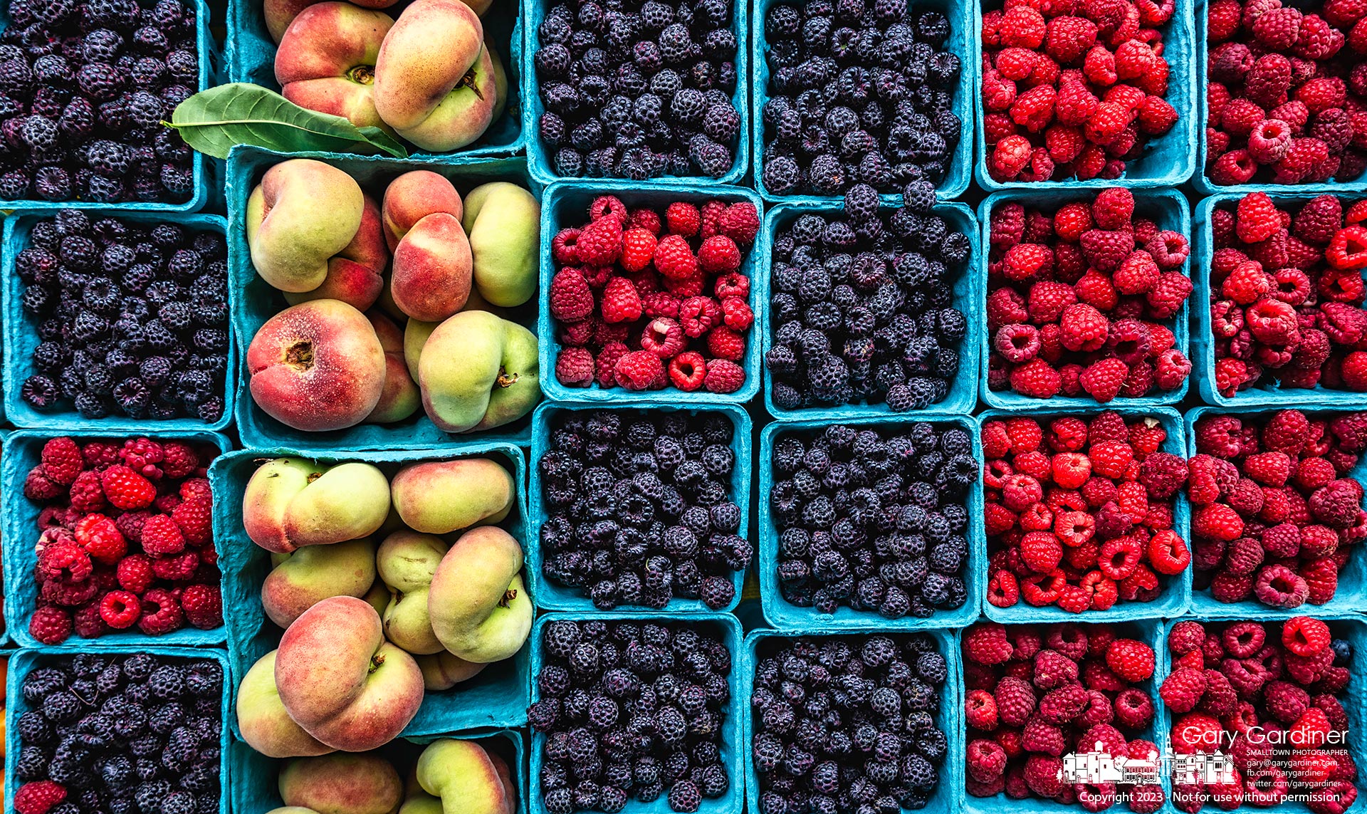 A collection of colorful fruit fills the table of an Amish farmer selling produce at the Saturday Farmers Market in Uptown Westerville. My final Photo for July 15, 2023.