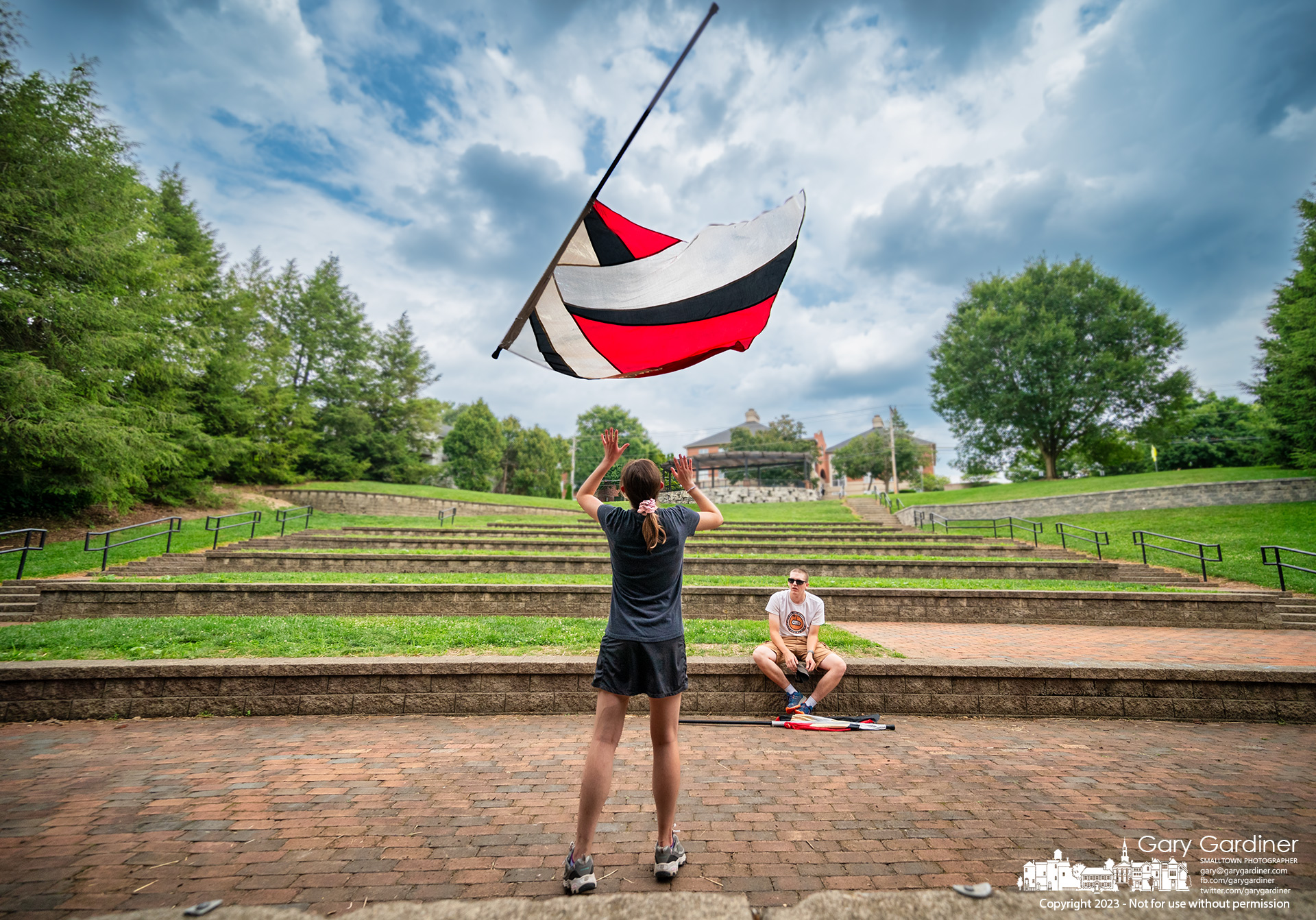 An Otterbein University Color Guard member practices with some of the team at the Alum Creel Park Amphitheater as they prepare for the start of football season at home on September 2 against Ohio Wesleyan University. My Final Photo for August 9, 2023.