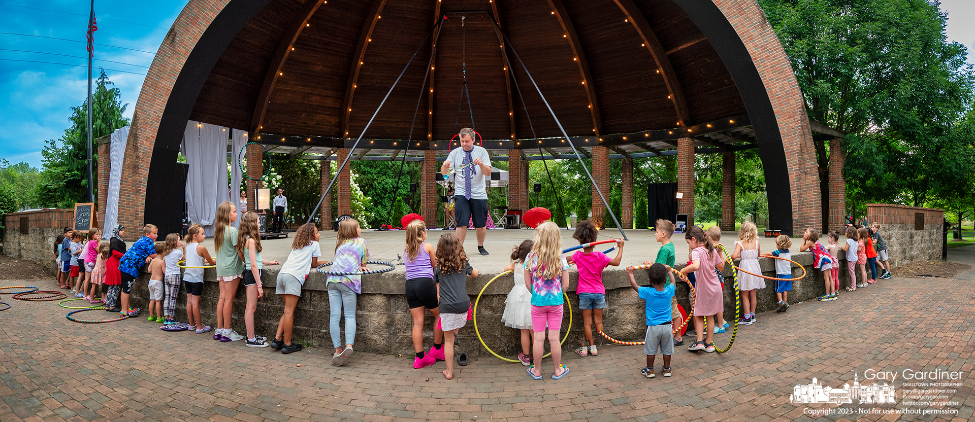 Kids line the Alum Creek Amphitheater stage as yo-yo expert Chazz Miller opens the Amazing Circus Show Saturday night. My Final Photo for August 5, 2023.