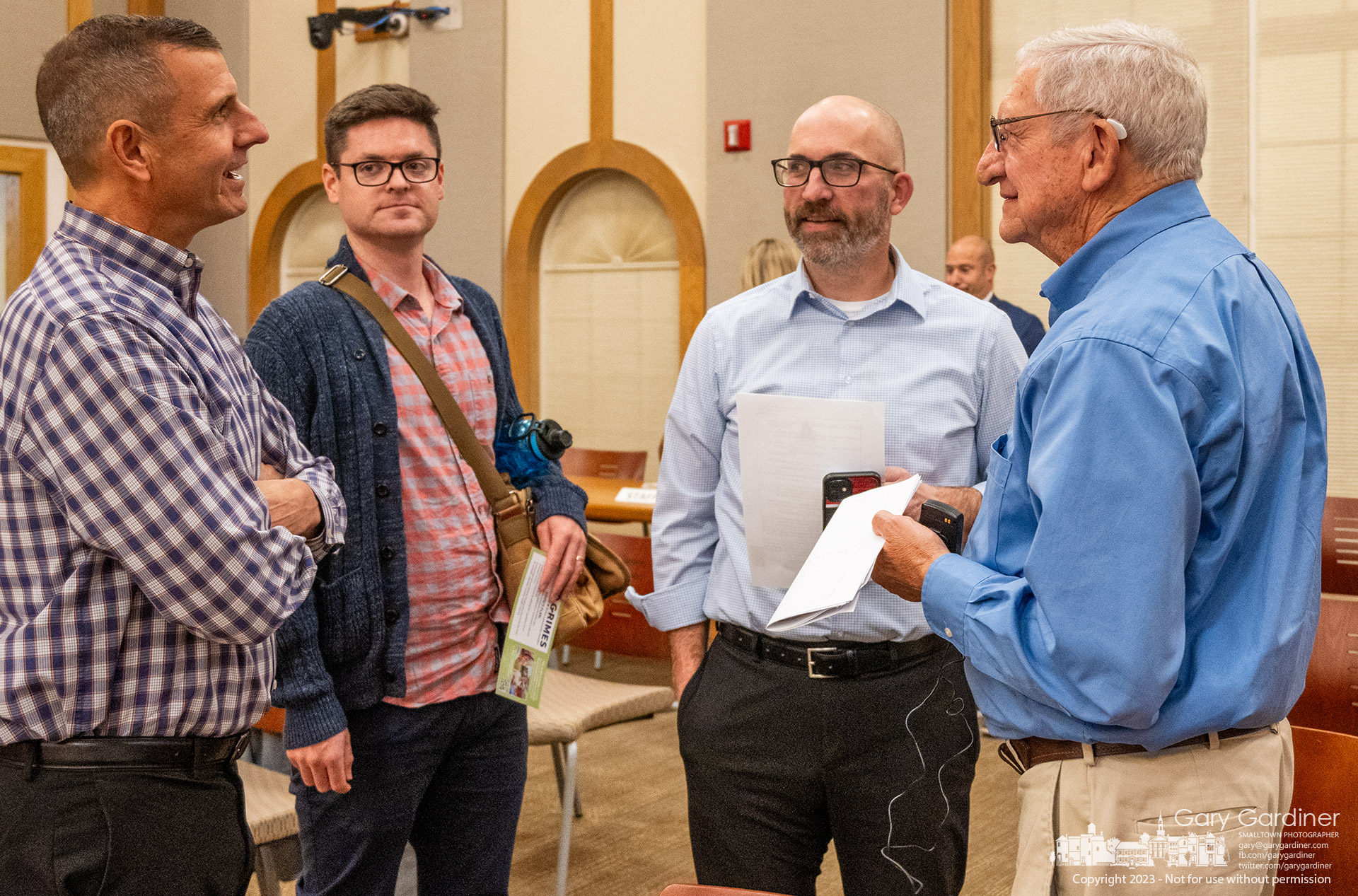 Tom Curry, right, talks with three Westerville City Council candidates after a council meeting where he spoke during citizens' comments about the lack of news media coverage of candidates for local elections. From left to right are candidates Aaron Glasgow, David Grimes, and Jeff Washburn. My Final Photo for October 17, 2023.