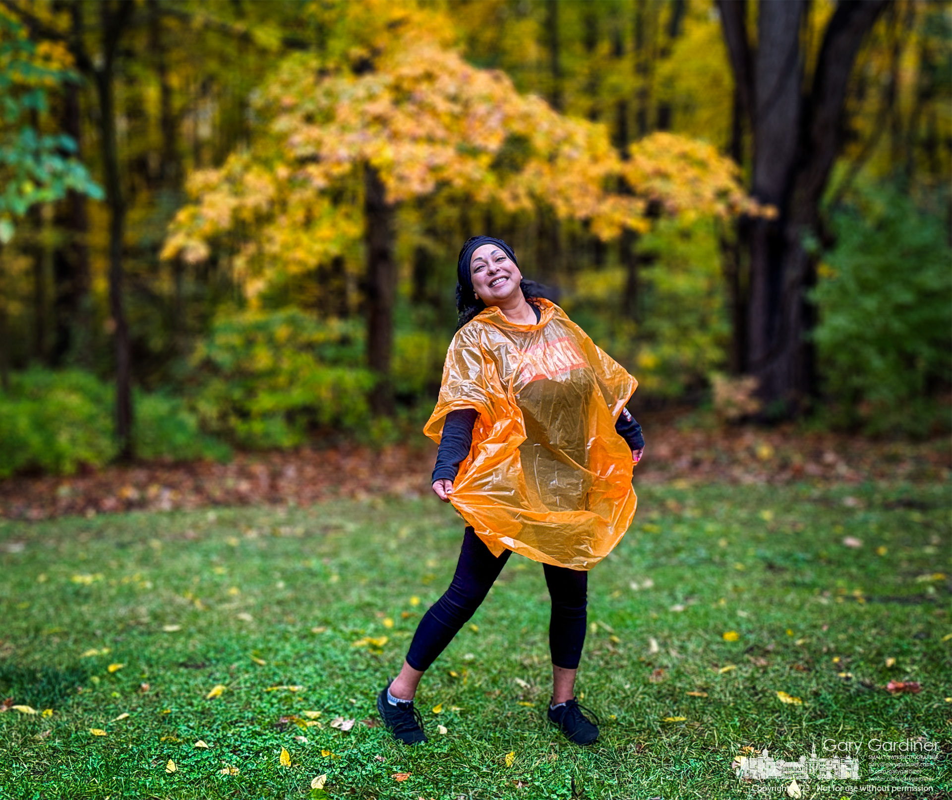 Jackie, the mother of a third-grader on a field trip to Inniswood, laughs as she shows off the pumpkin-colored rain poncho she wears that she is convinced embarrassed her child. My Final Photo for October 20, 2023. 