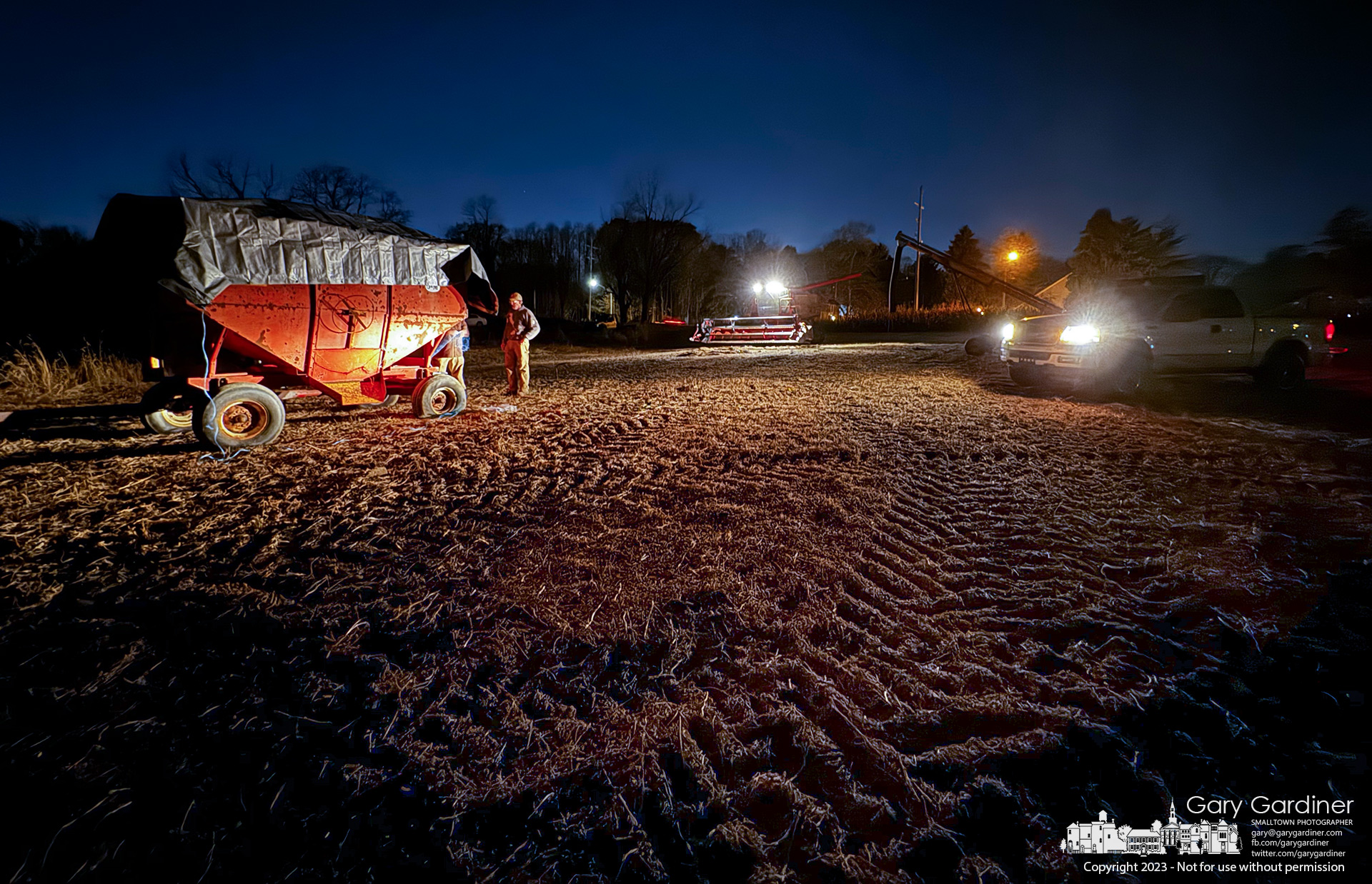 Kevin Scott and Rodney Parker work into the night to fill wagons with soybeans harvested from the Braun Farm. My Final Photo for November 15, 2023.