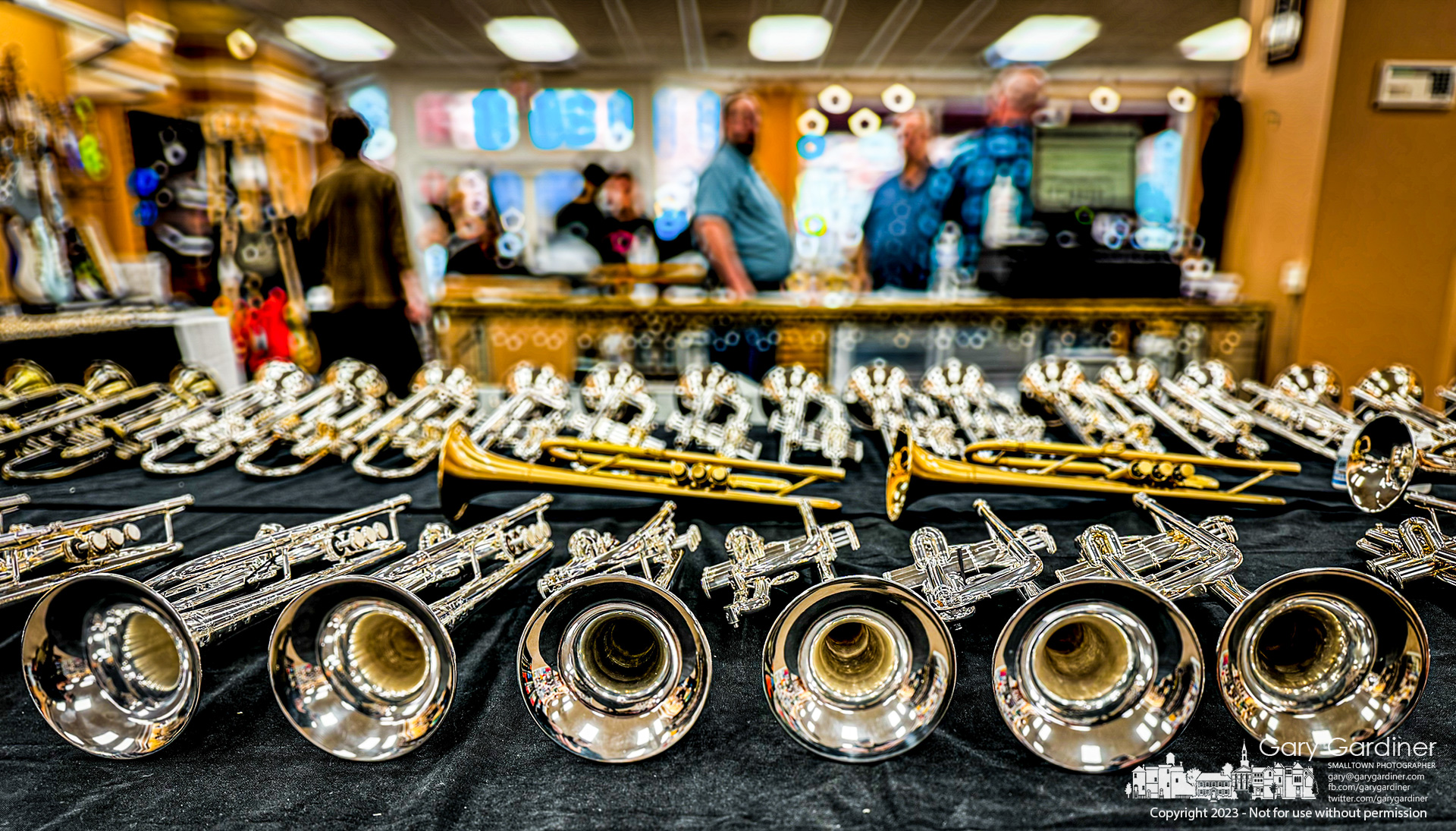 Rows of instruments line temporarily assembled tables as Music & Arts in Uptown holds its annual sale with most of the floor space occupied with brass, wind, stringed, and percussion instruments. My Final Photo for November 11, 2023.