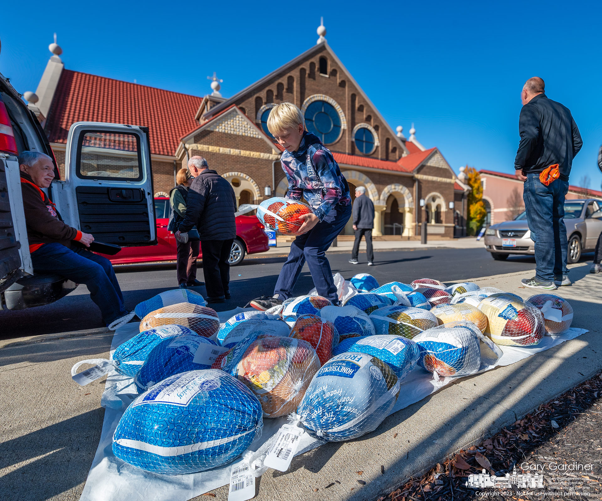 Volunteers stack almost 400 frozen turkeys donated Sunday morning at St. Paul the Apostle Catholic Church for the food kitchen at Holy Rosary/St. John in downtown Columbus. My Final Photo for November 19, 2023.