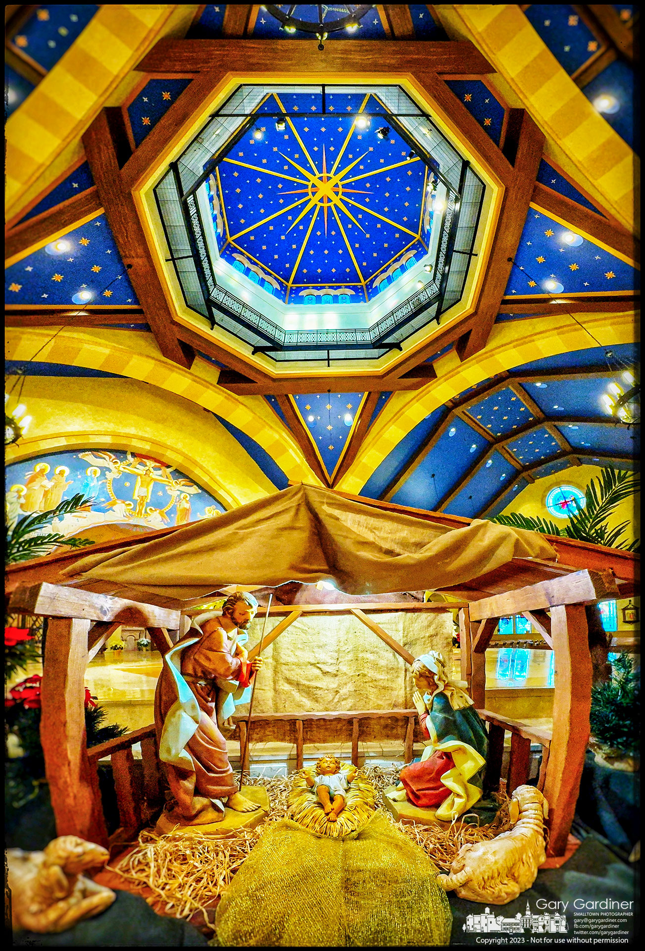 The Nativity scene sits near the altar beneath the star in the dome of St. Paul the Apostle Catholic Church on Christmas morning. My Final Photo for December 25, 2023.