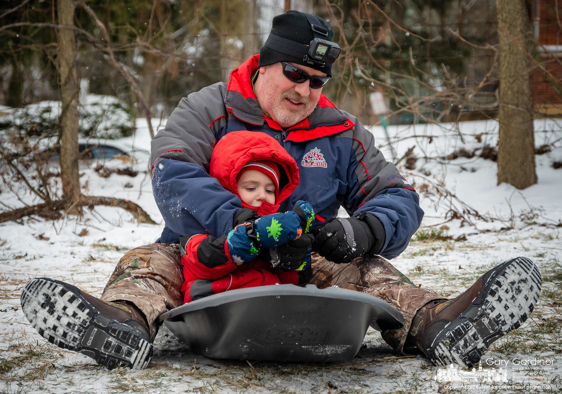 Father and son settle into their sled before making their first run down the sledding hill at Alum Creek Park North on Main Street in Westerville. My Final Photo for January 19, 2024.