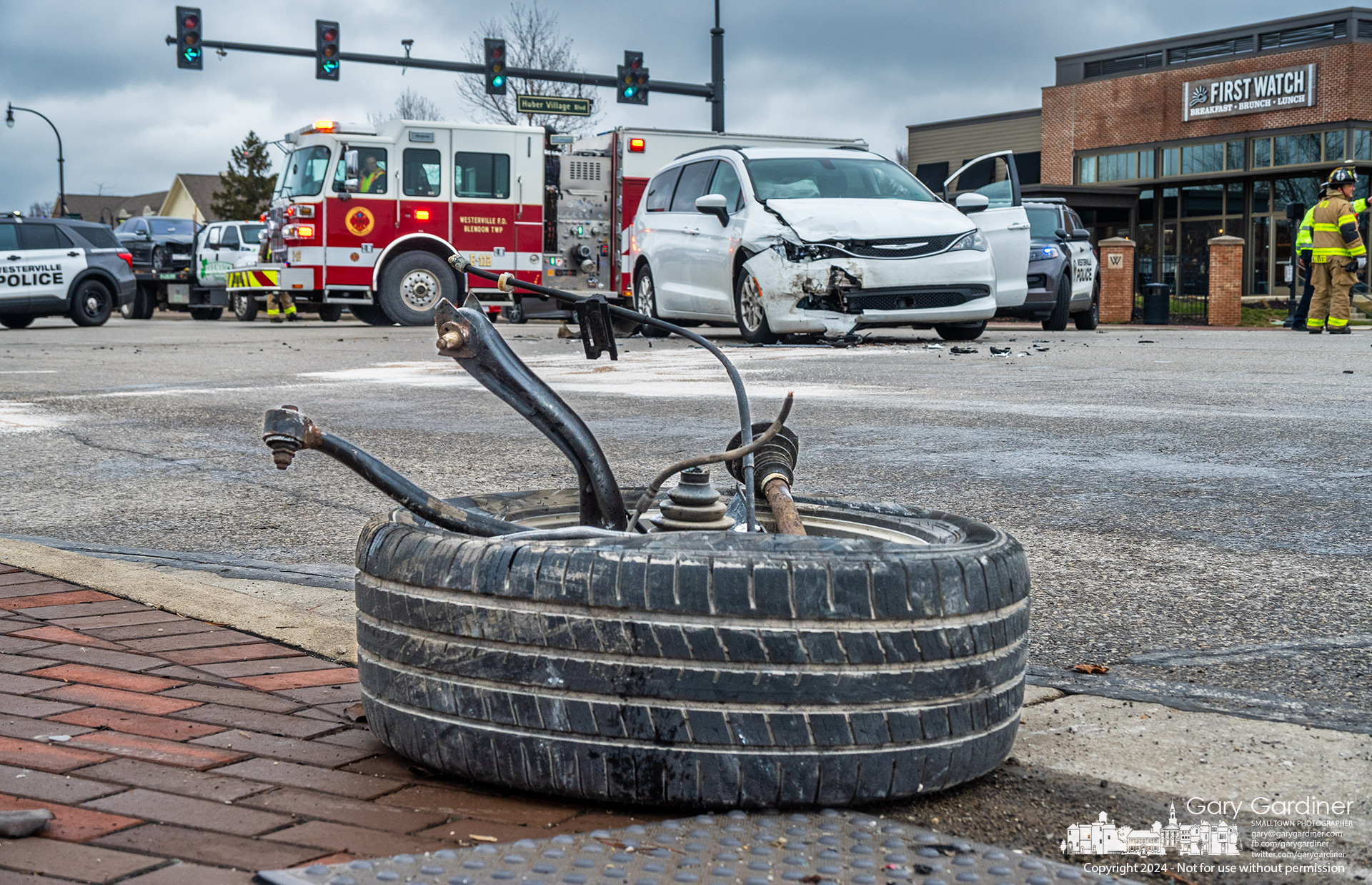 A rear tire sits on the sidewalk after it was separated from a car in a crash at South State Street and Heatherdown Drive. My Final Photo for January 26, 2024.