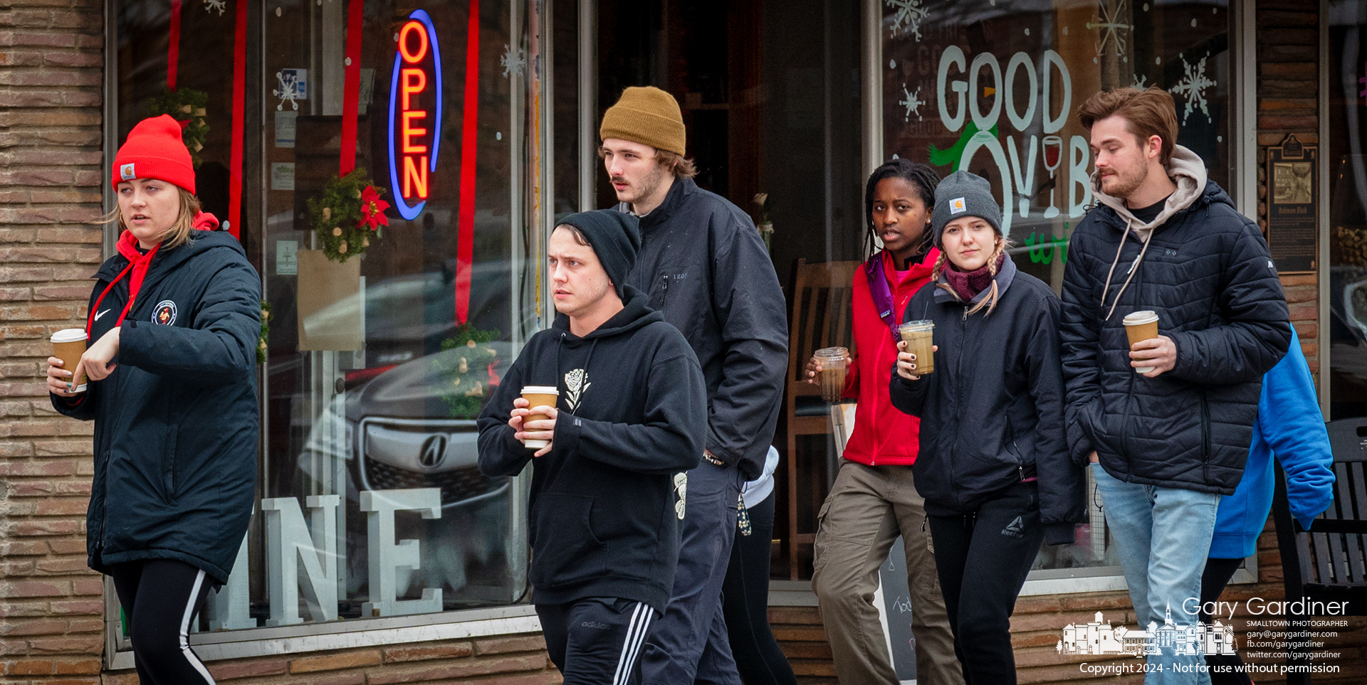 With coffee in hand, a group walks briskly from the coffee shop through Uptown Westerville on the coldest day of winter for the year. My Final Photo for January 13, 2024.