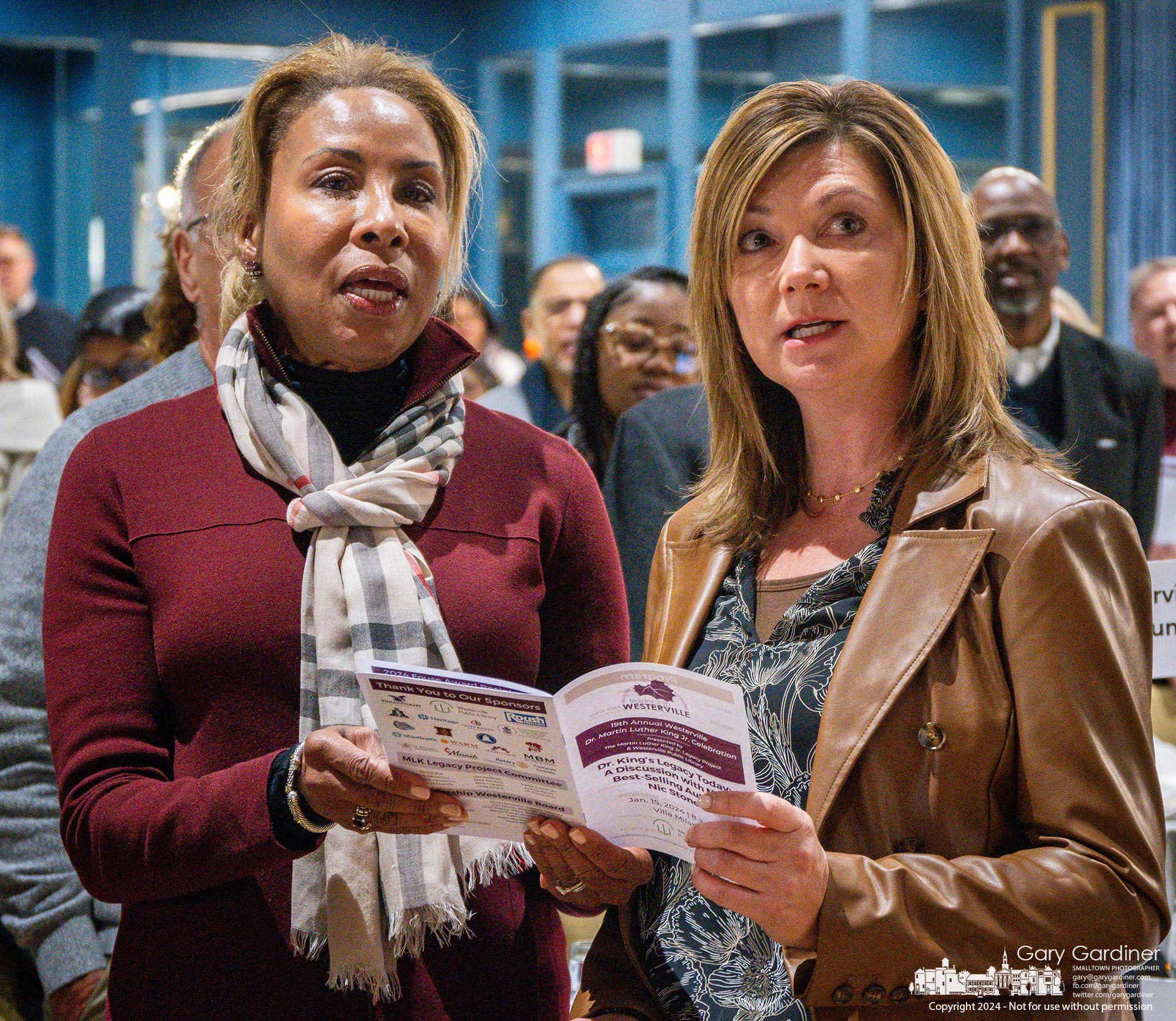 Attendees share a program as they sing an opening anthem for the 19th Annual Westerville Dr. Martin Luther King Celebration. My Final Photo for January 15, 2024.