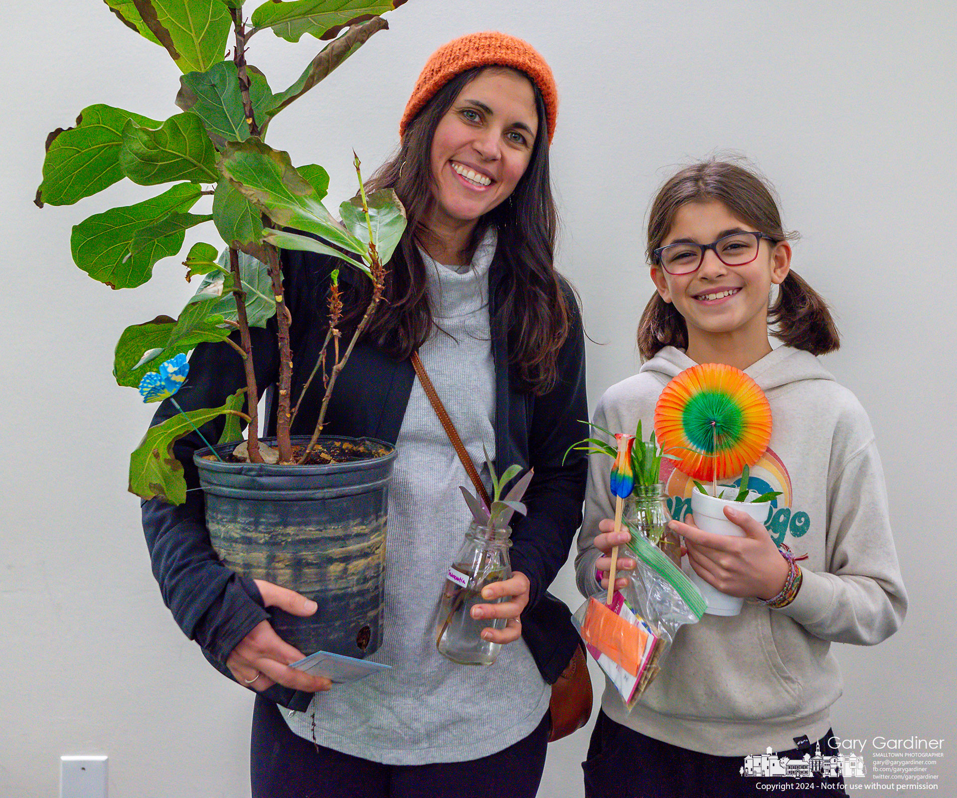 Mother and daughter stand with the plants and seeds they gathered at the Seed and Plant Exchange Saturday afternoon in the Westerville Public Library. My Final Photo for January 27, 2024.