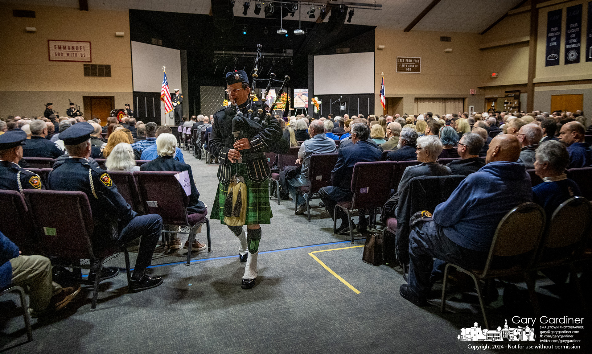 A bagpiper exits the sanctuary at Heritage Christian Church after the Celebration of Life Ceremony for retired Westerville Battalion Chief Andy Hicks who died last week, My Final Photo for February 5, 2024.