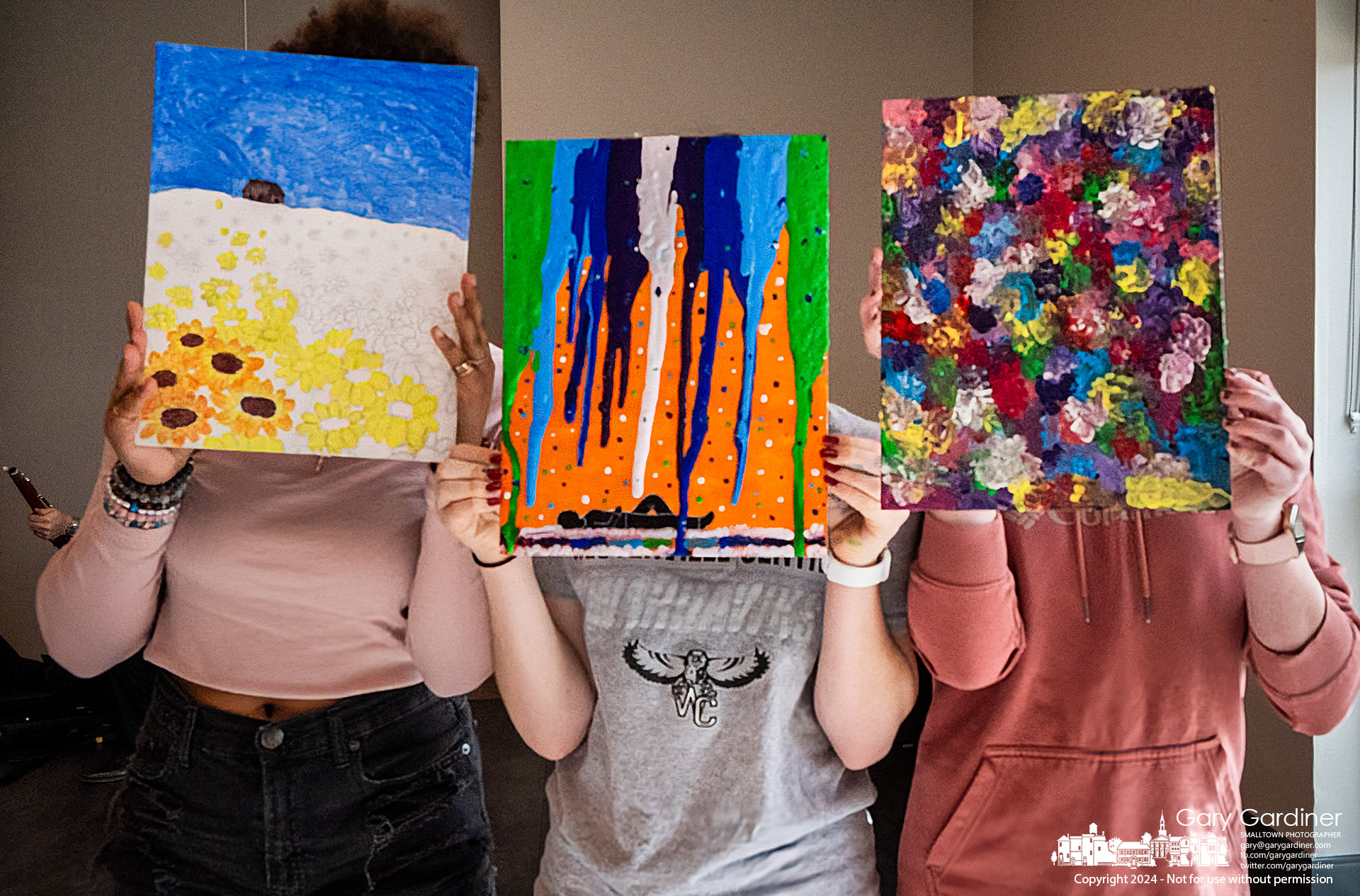 Three young artists show their works created on the theme of the environment during a performance by the woodwind section of The Westerville Symphony at the Women in Science event at the Westerville Community Center. My Final Photo for February 10, 2024.