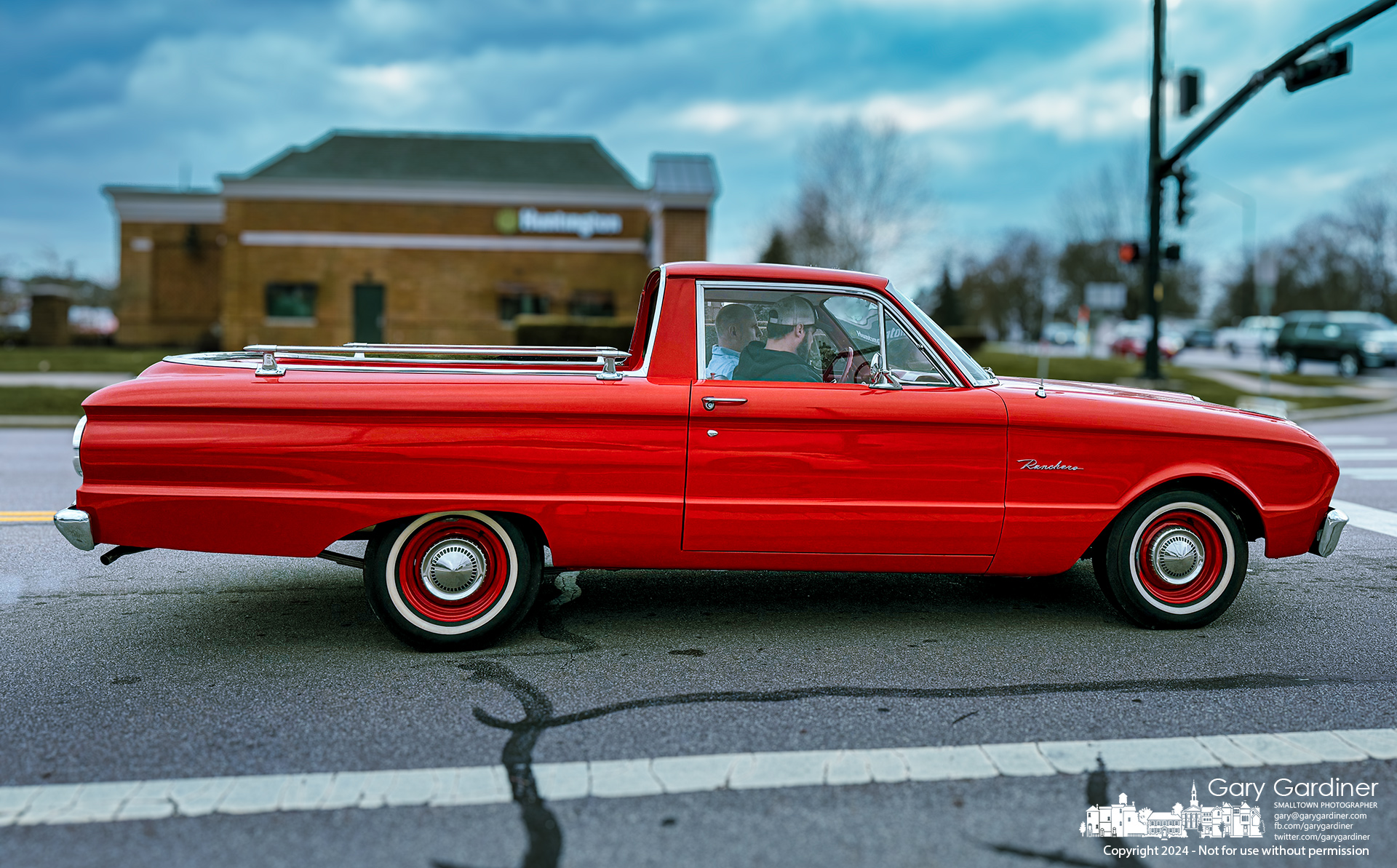 A bright red early 1960s Ford Falcon Ranchero waits at the signal light to turn onto State Street from Maxtown during a midafternoon trip. My Final Photo for March 27, 2024.