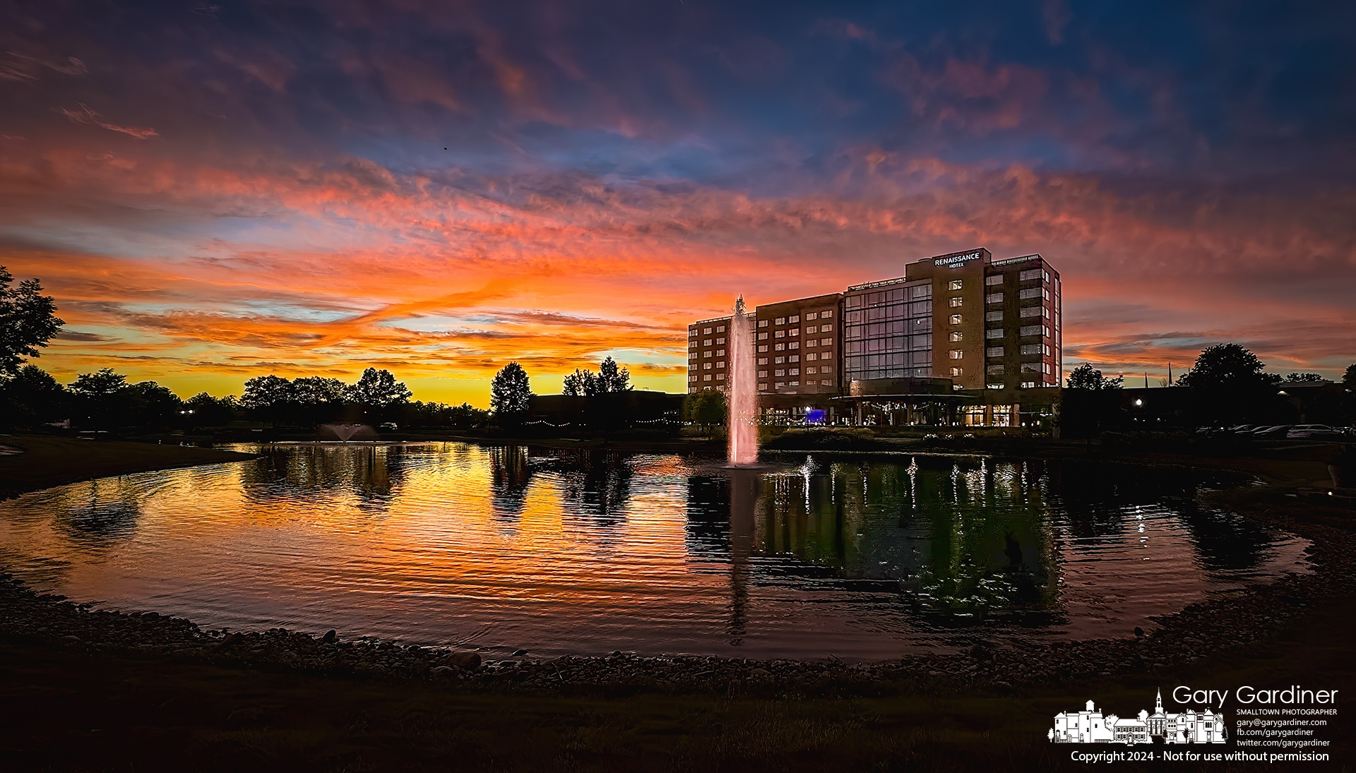 The sunset behind the Renaissance Hotel in Westerville is reflected in Guitar Lake, a large holding pond for the Westar development. My Final Photo for June 26, 2024.