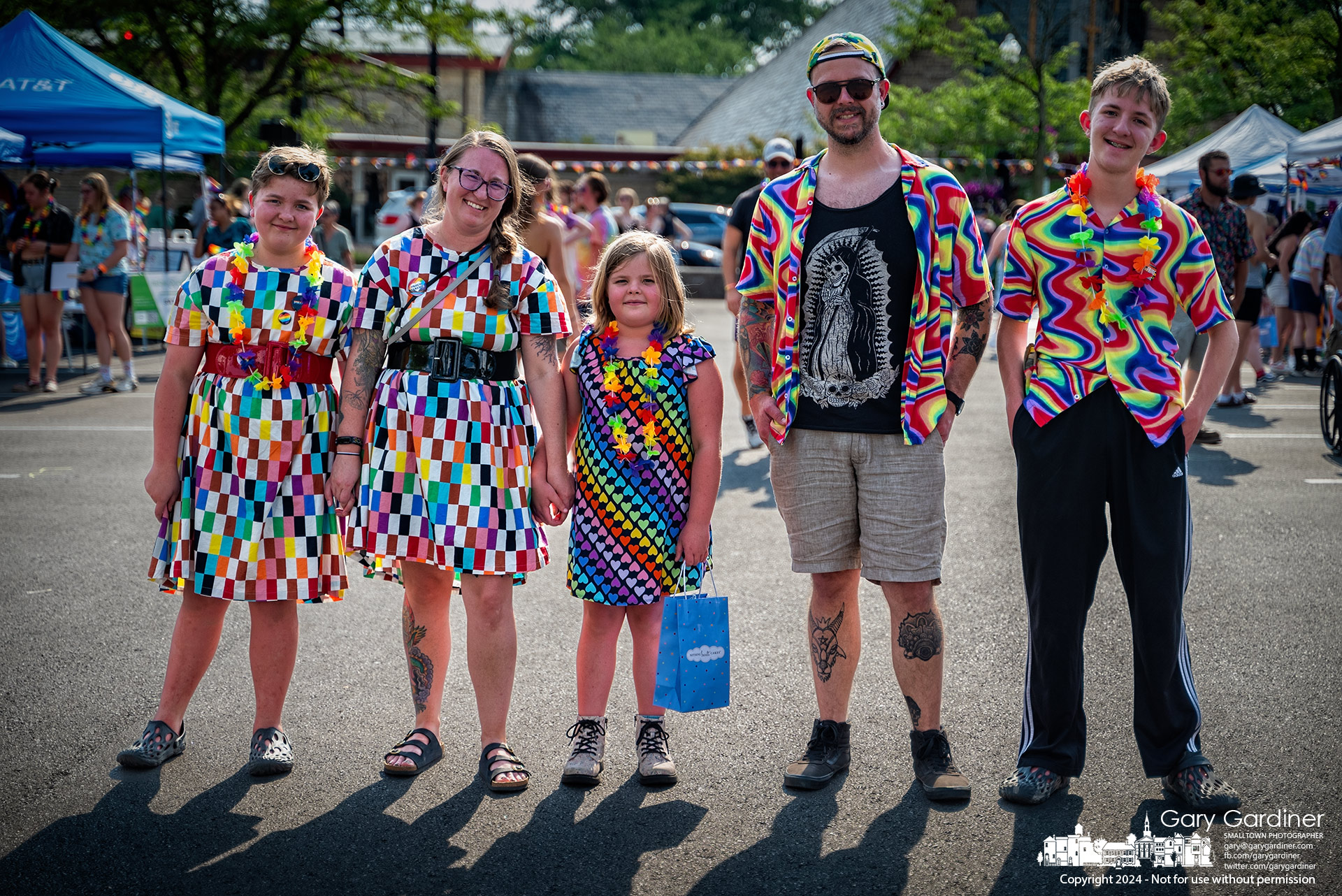 The Decker family, from left to right, Alyce, Katie, Blive, Kevin, and Aaren, pose for a photo wearing rainbow-colored clothing at the Pride celebration in the parking lot in front of Birdies Books on North State Street in Uptown Westerville. My Final Photo for June 22, 2024.