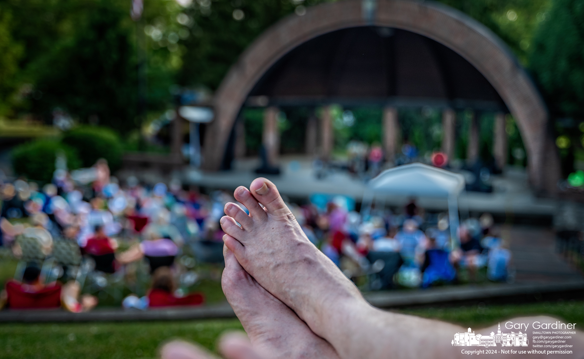 Taking advantage of cooler temperatures and a slight breeze, one of RoxieJanes' fans slipped off his shoes to enjoy an evening of music in the amphitheater at Alum Creek Park North. My Final Photo for June 23, 2024.