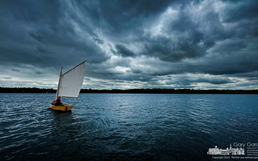 In His Homemade Wooden Boat