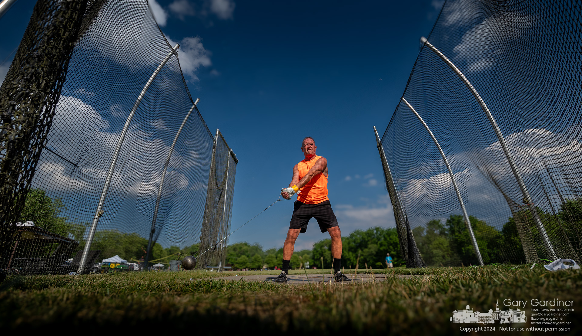 A senior athlete twists his shoulders as he begins the hammer throw at the late afternoon national qualifier competition during the Ohio Senior Olympics at Otterbein University's sports fields. My Final Photo for June 14, 2024.