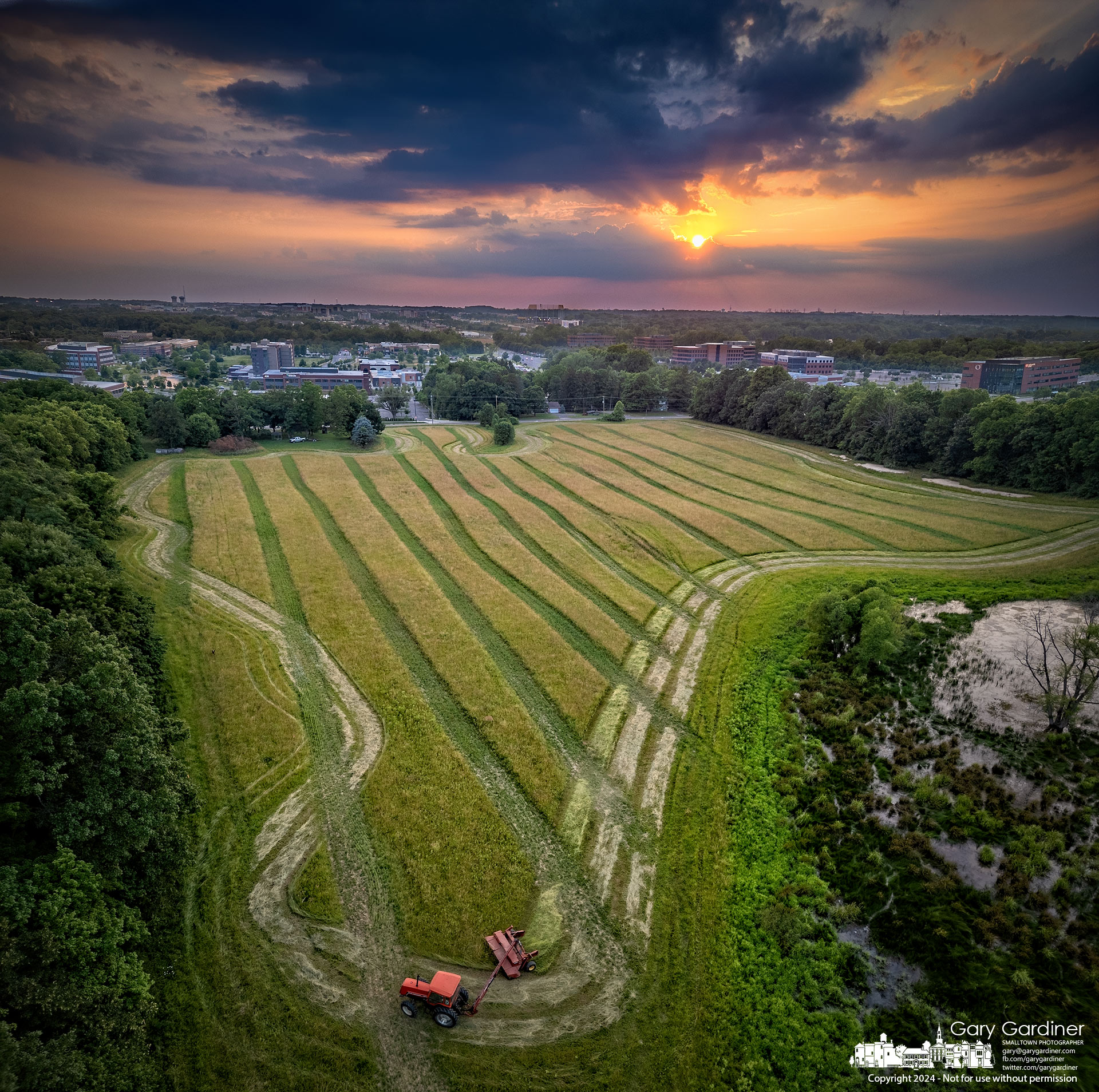 A farmer begins the hay cut near sunset for the cooler part of the day on the main field at the Sharp Farm property on Africa Road. My Final Photo for June 20, 2024.