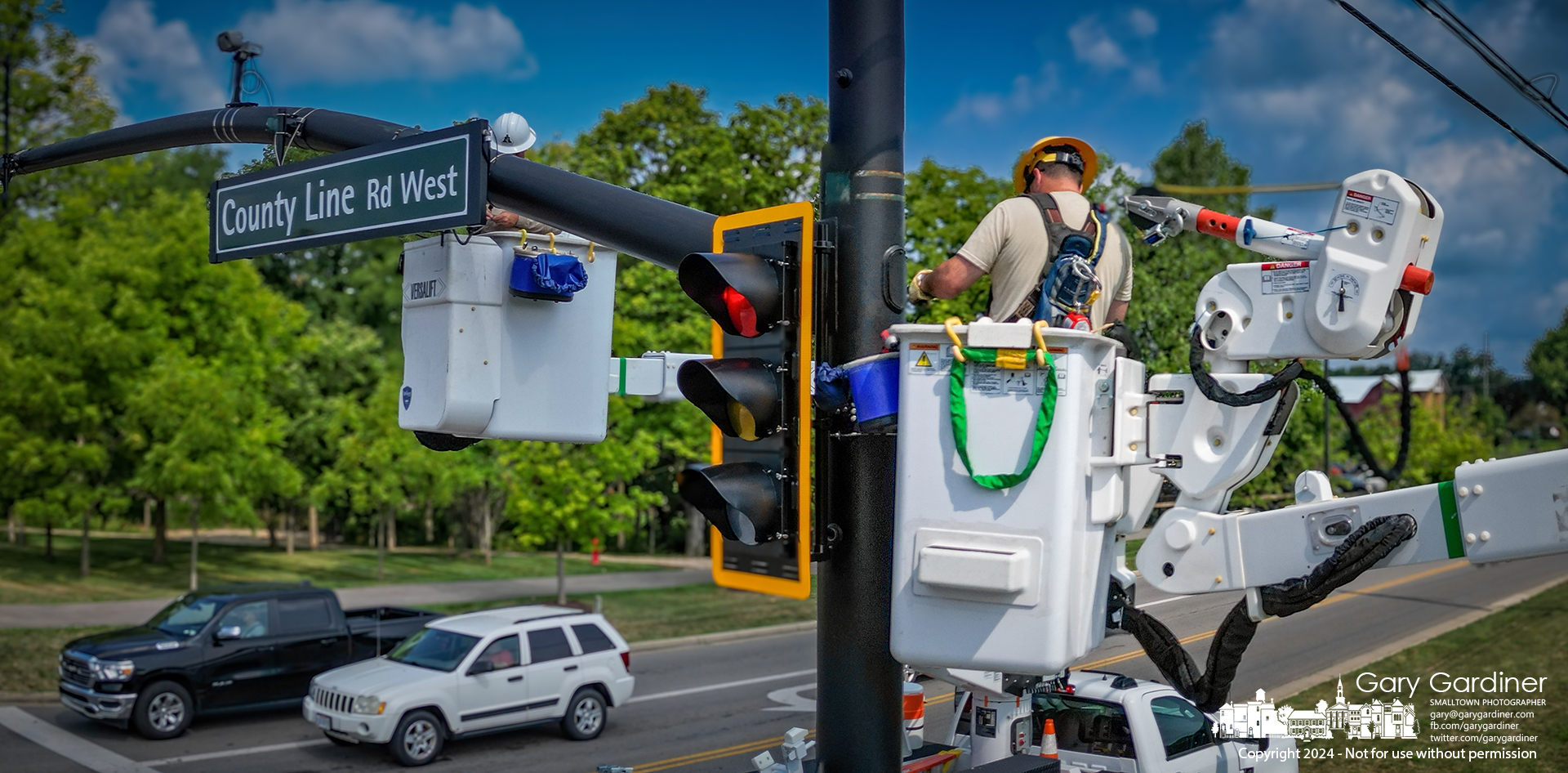 Westerville Electric workers install the final wiring harness in a traffic signal pole at Africa Road and County Line Road, replacing everything but the poles at the intersection. My Final Photo for July 25, 2024.